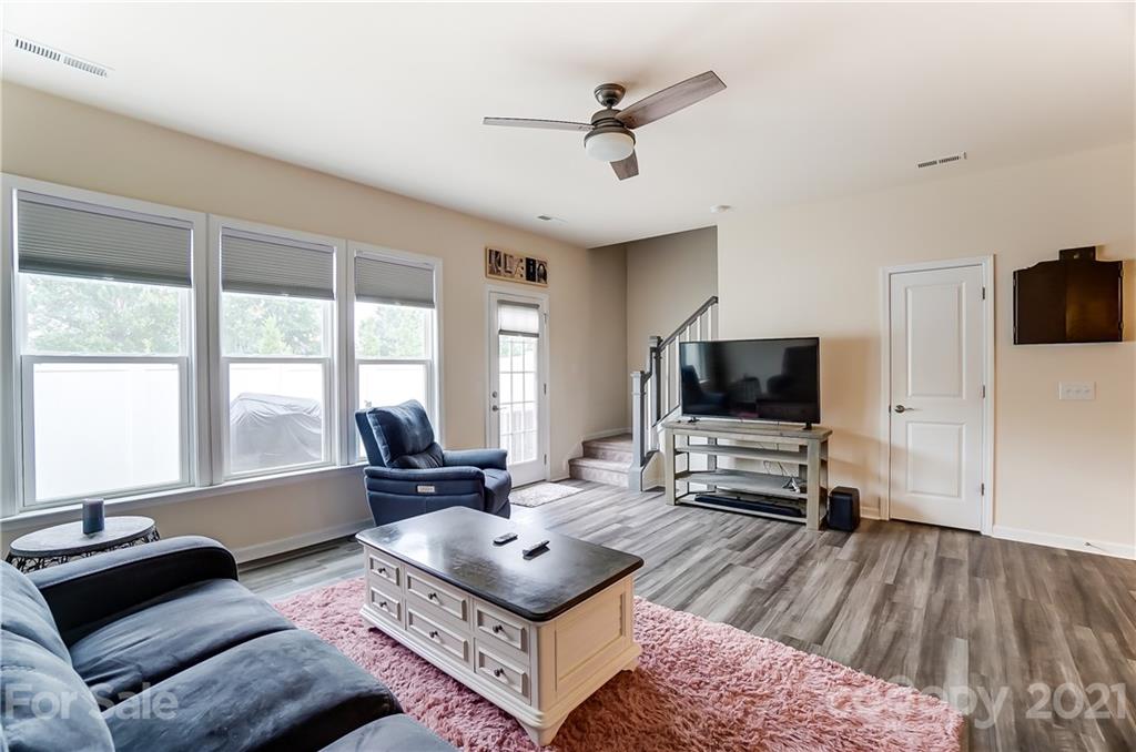929 Wicawa Road Fort Mill, SC 29708 - Photo 14 of 28 a living room with furniture and a flat screen tv