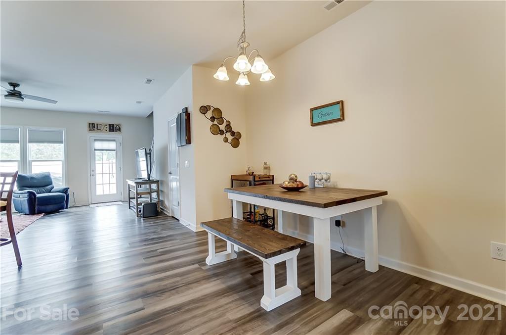 929 Wicawa Road Fort Mill, SC 29708 - Photo 6 of 28 a view of a livingroom with furniture and wooden floor