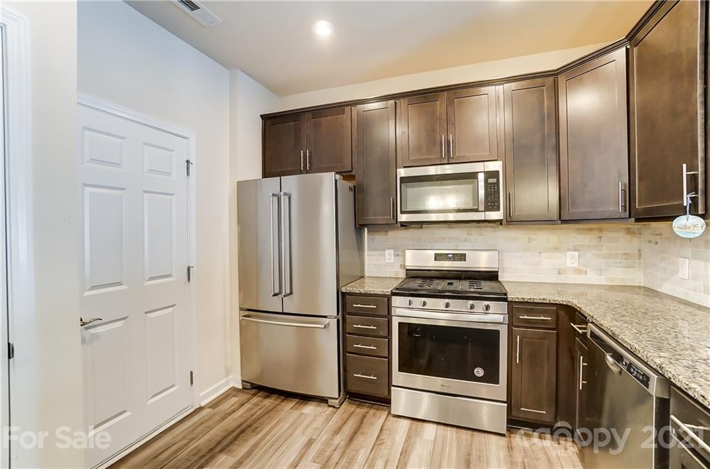 929 Wicawa Road Fort Mill, SC 29708 - Photo 10 of 28 a kitchen with a stove microwave and refrigerator
