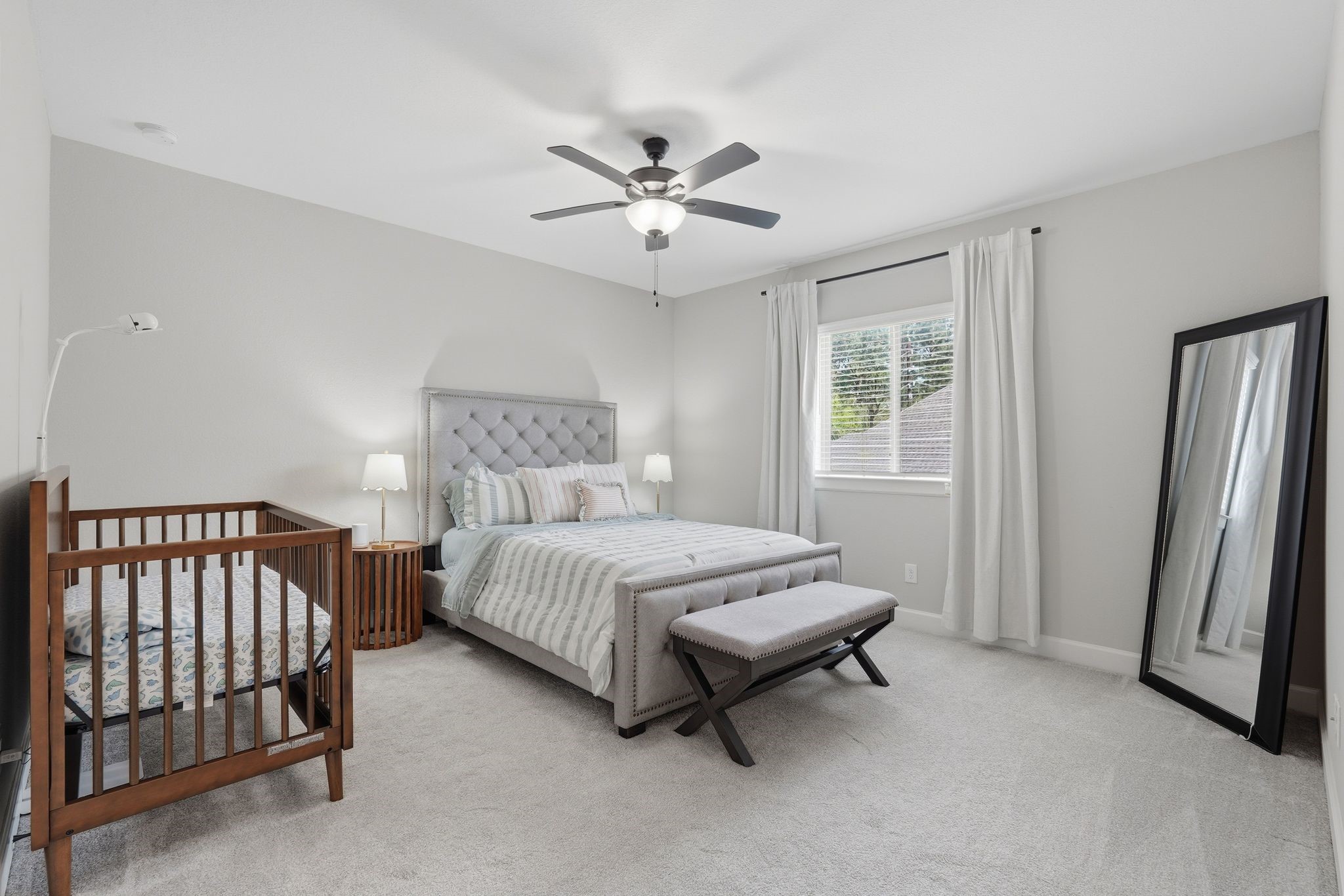 24423 Morningside Terrace Tomball, TX 77375 - Photo 18 of 47 a spacious bedroom with a bed and a chandelier
