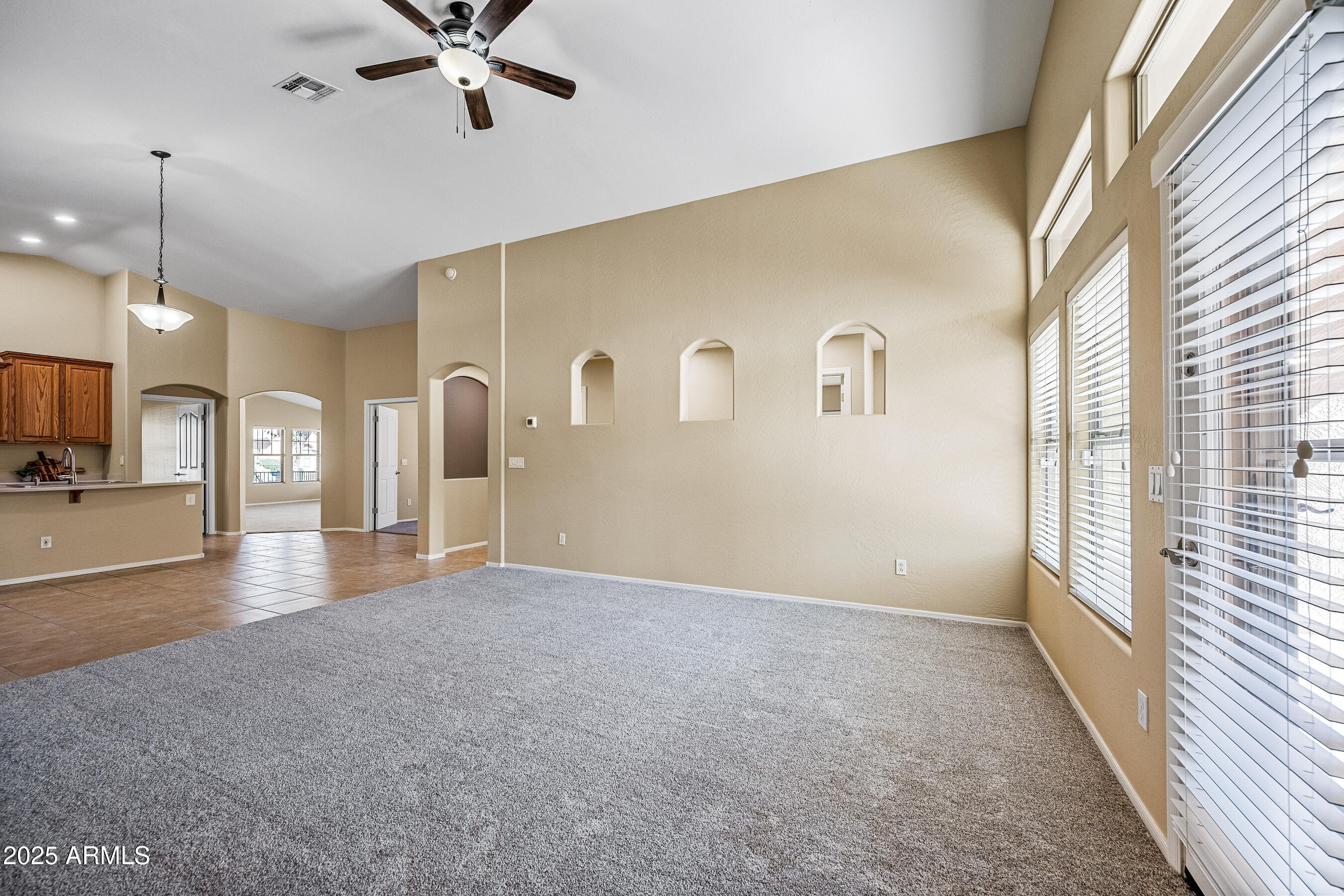 3471 East Fairview Street Gilbert, AZ 85295 - Photo 11 of 48 a view of a livingroom with a ceiling fan and window