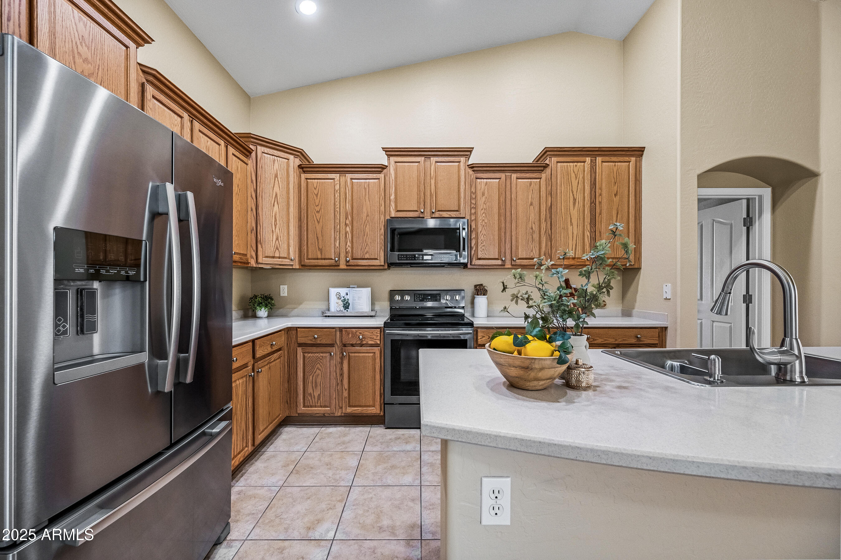 3471 East Fairview Street Gilbert, AZ 85295 - Photo 14 of 48 a kitchen with a refrigerator and a sink