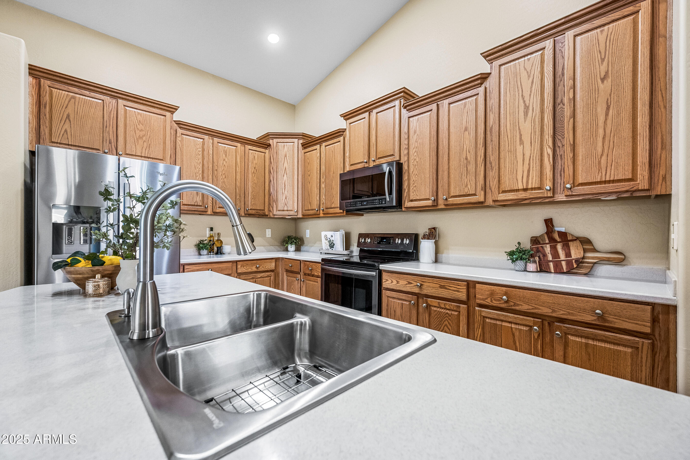 3471 East Fairview Street Gilbert, AZ 85295 - Photo 15 of 48 a kitchen with stainless steel appliances granite countertop a sink dishwasher stove and refrigerator with wooden floor