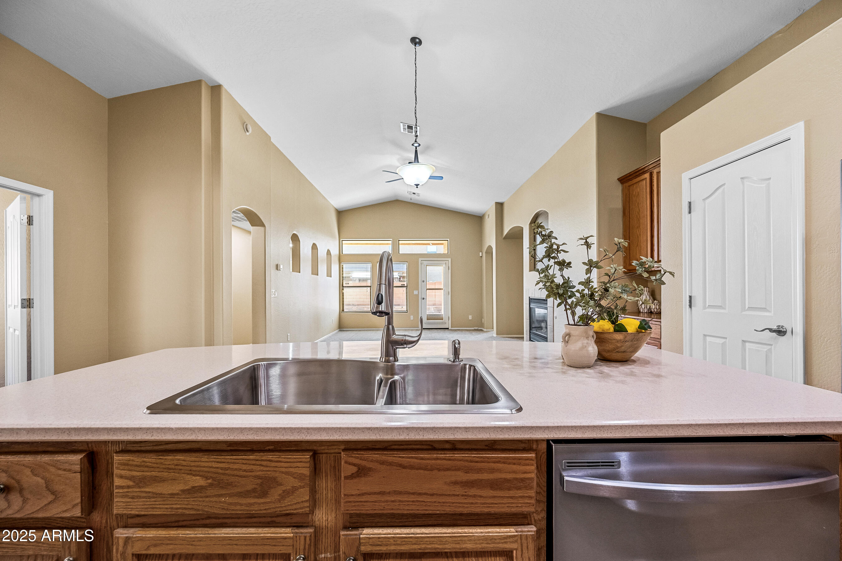 3471 East Fairview Street Gilbert, AZ 85295 - Photo 17 of 48 a kitchen with a sink and chandelier
