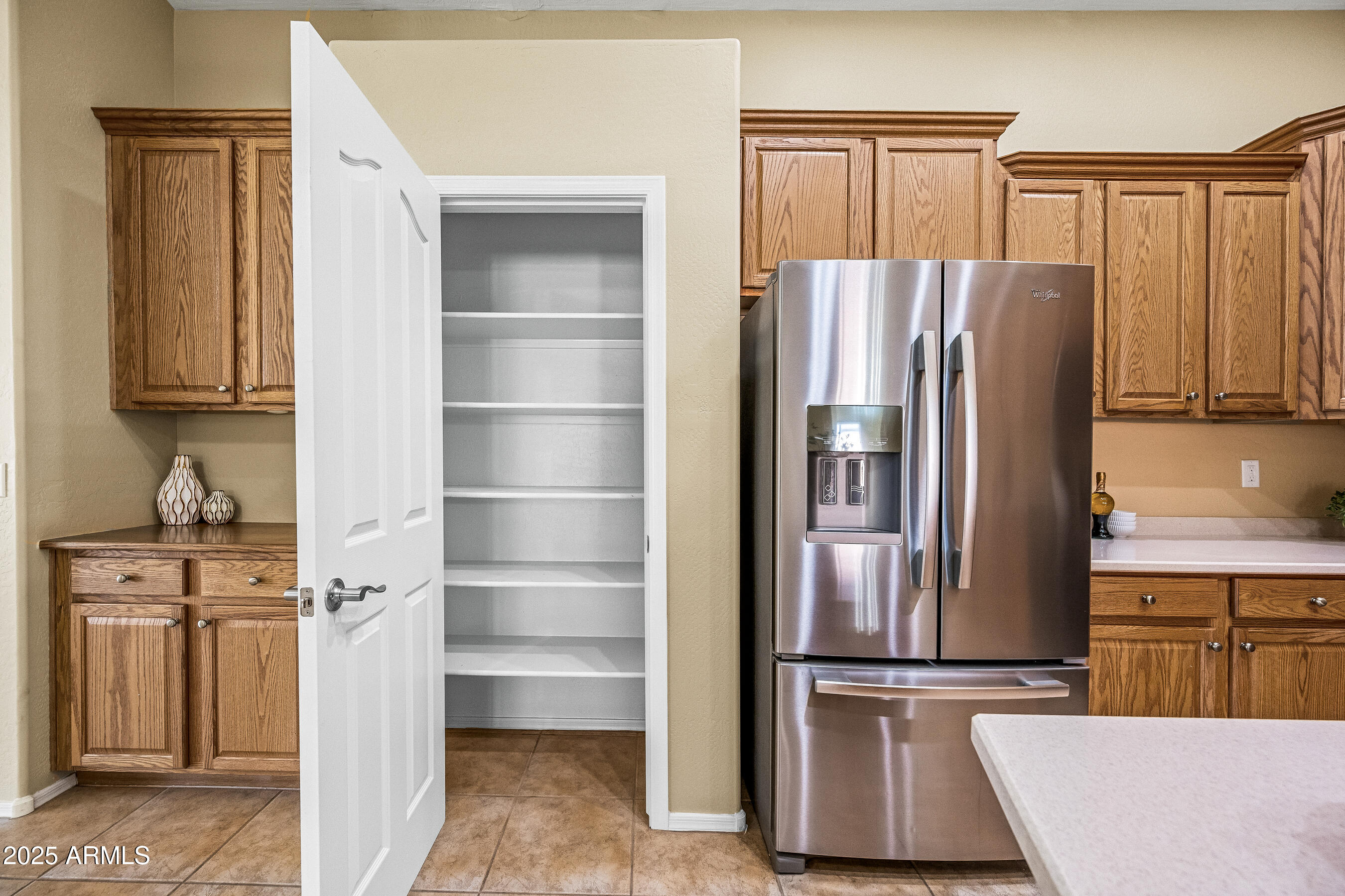 3471 East Fairview Street Gilbert, AZ 85295 - Photo 18 of 48 a kitchen with stainless steel appliances granite countertop a refrigerator and a stove