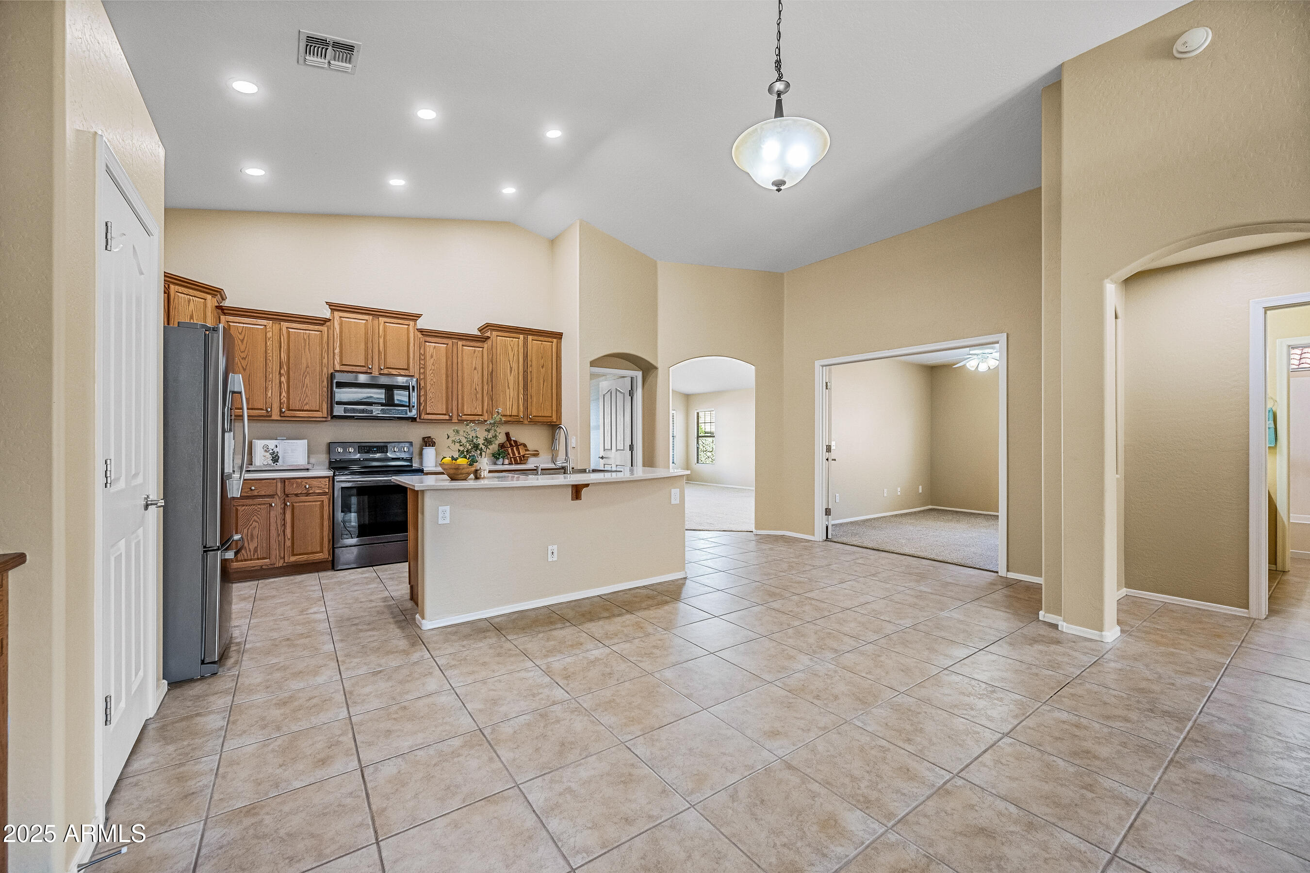 3471 East Fairview Street Gilbert, AZ 85295 - Photo 19 of 48 a large kitchen with cabinets and stainless steel appliances