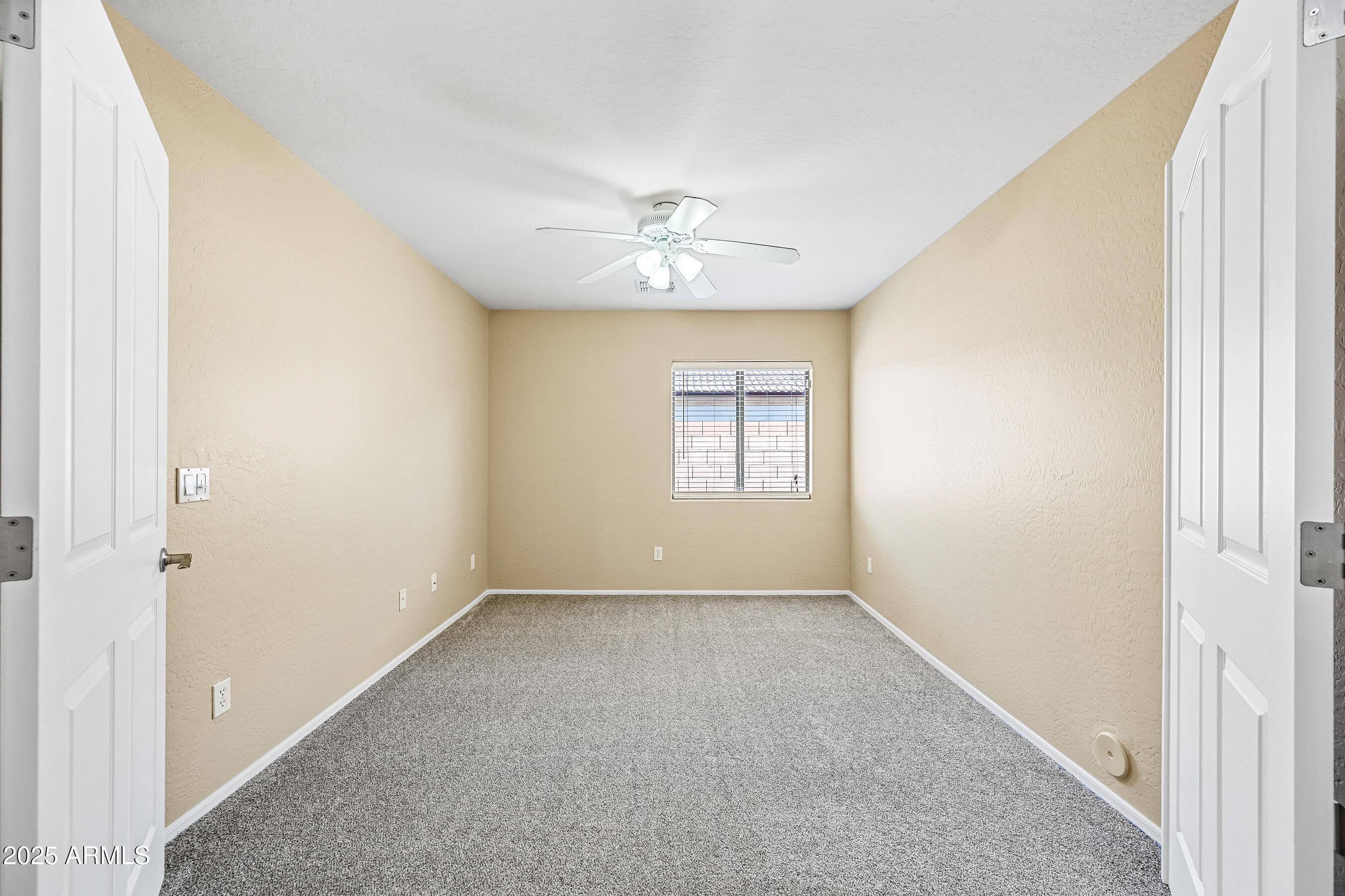 3471 East Fairview Street Gilbert, AZ 85295 - Photo 21 of 48 an empty room with windows and ceiling fan
