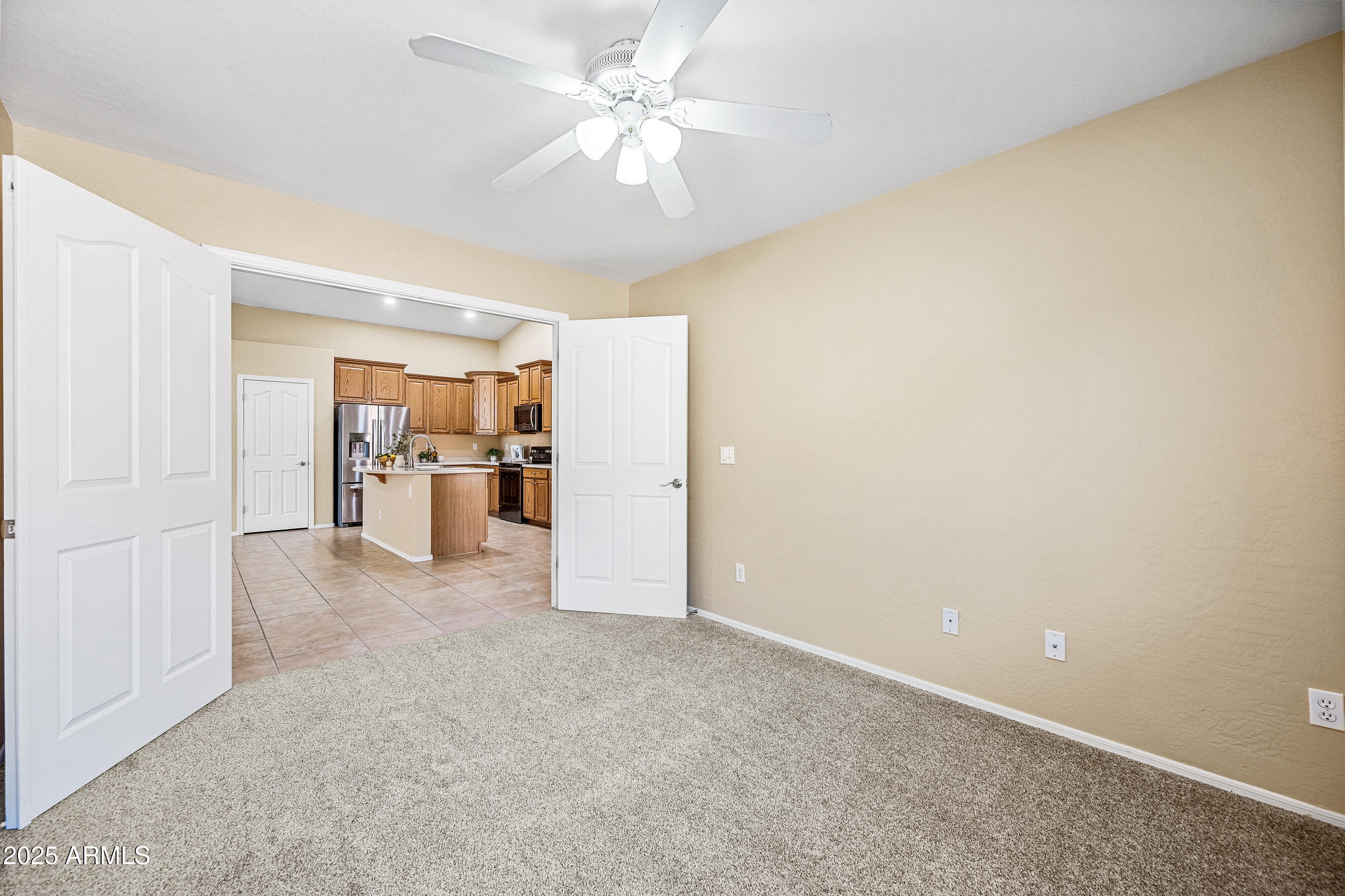 3471 East Fairview Street Gilbert, AZ 85295 - Photo 22 of 48 an empty room with a kitchen and a refrigerator
