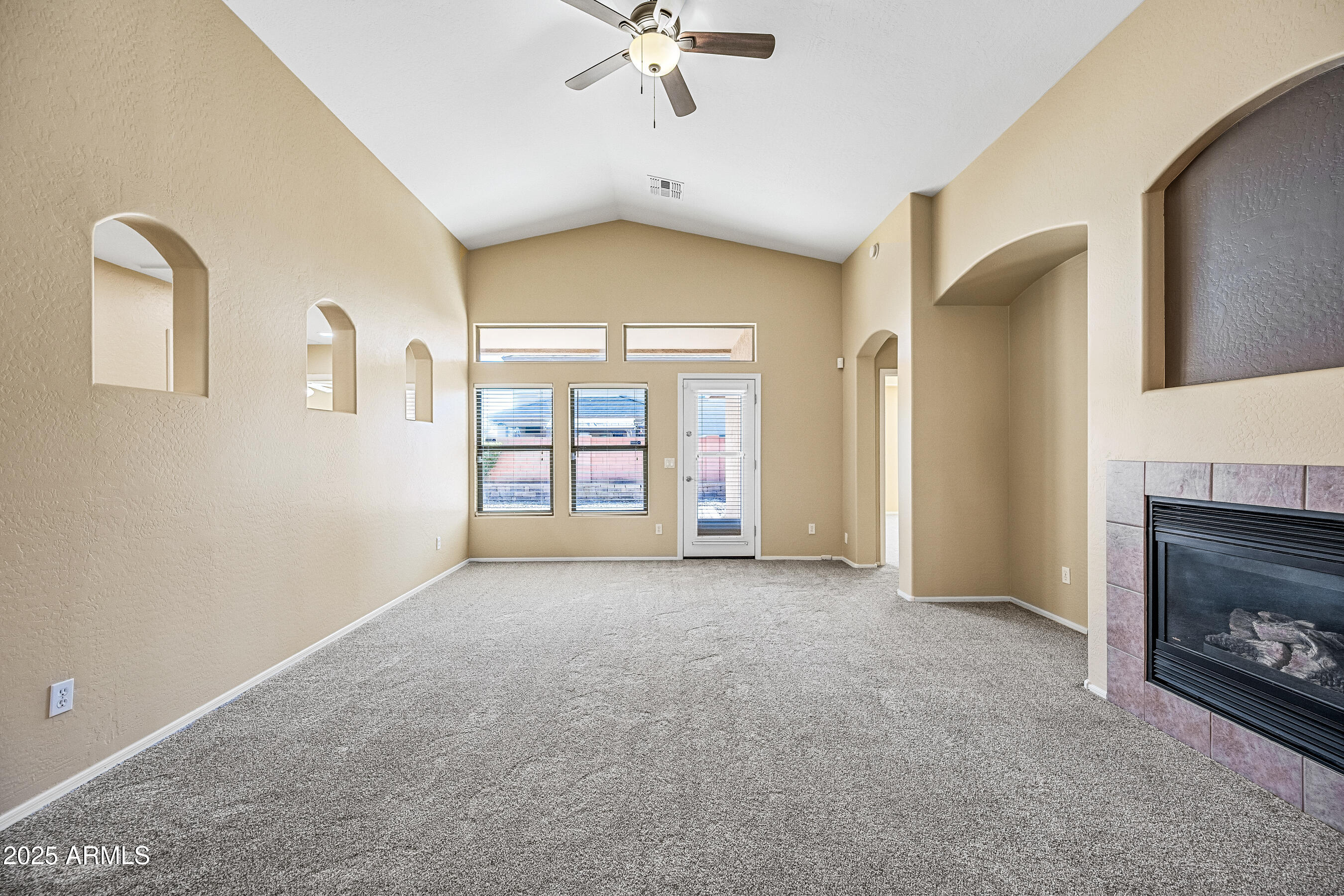 3471 East Fairview Street Gilbert, AZ 85295 - Photo 23 of 48 a view of an empty room with a fireplace and a window