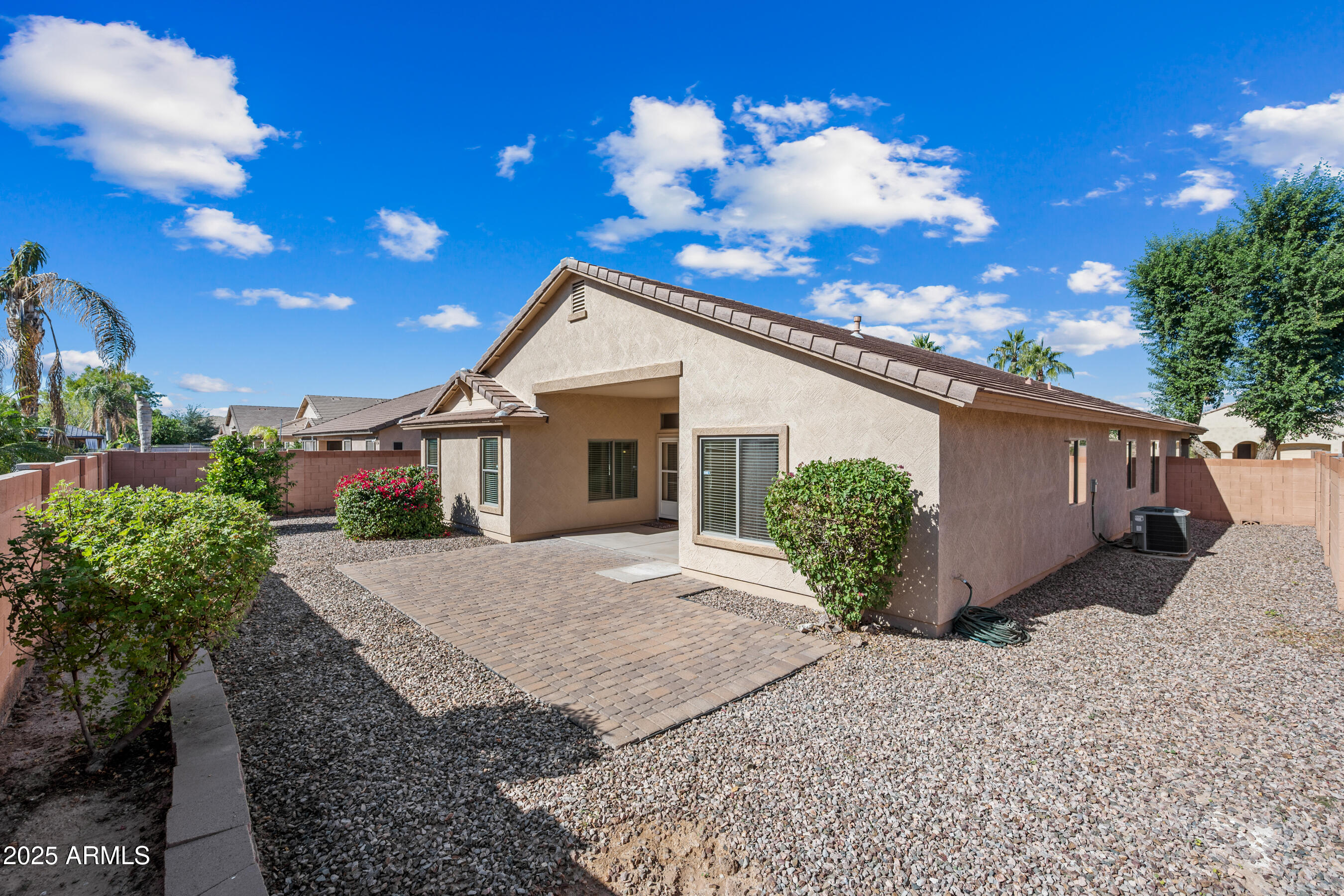 3471 East Fairview Street Gilbert, AZ 85295 - Photo 28 of 48 a view of a house with a yard and potted plants