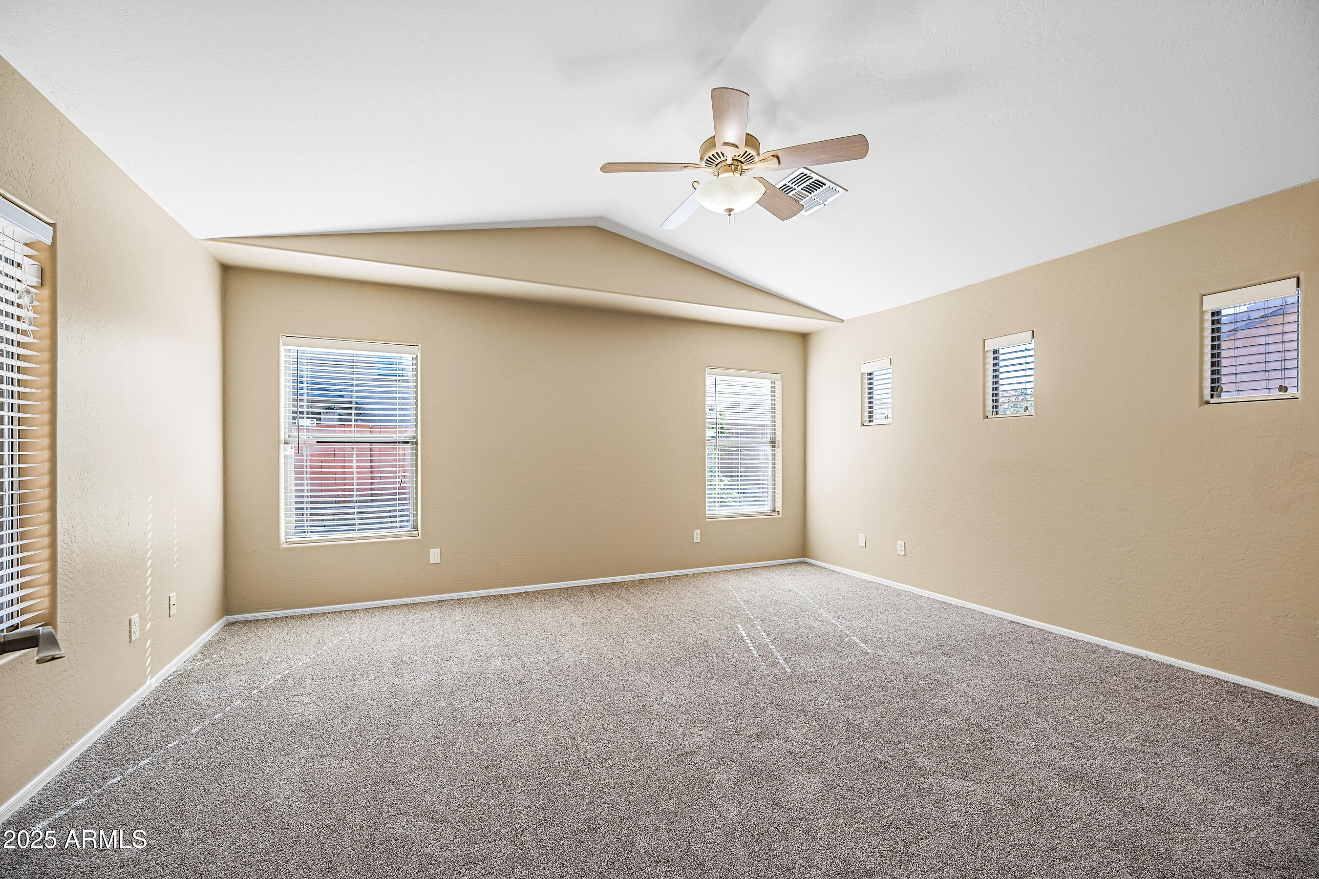 3471 East Fairview Street Gilbert, AZ 85295 - Photo 30 of 48 a view of an empty room with chandelier fan and a window