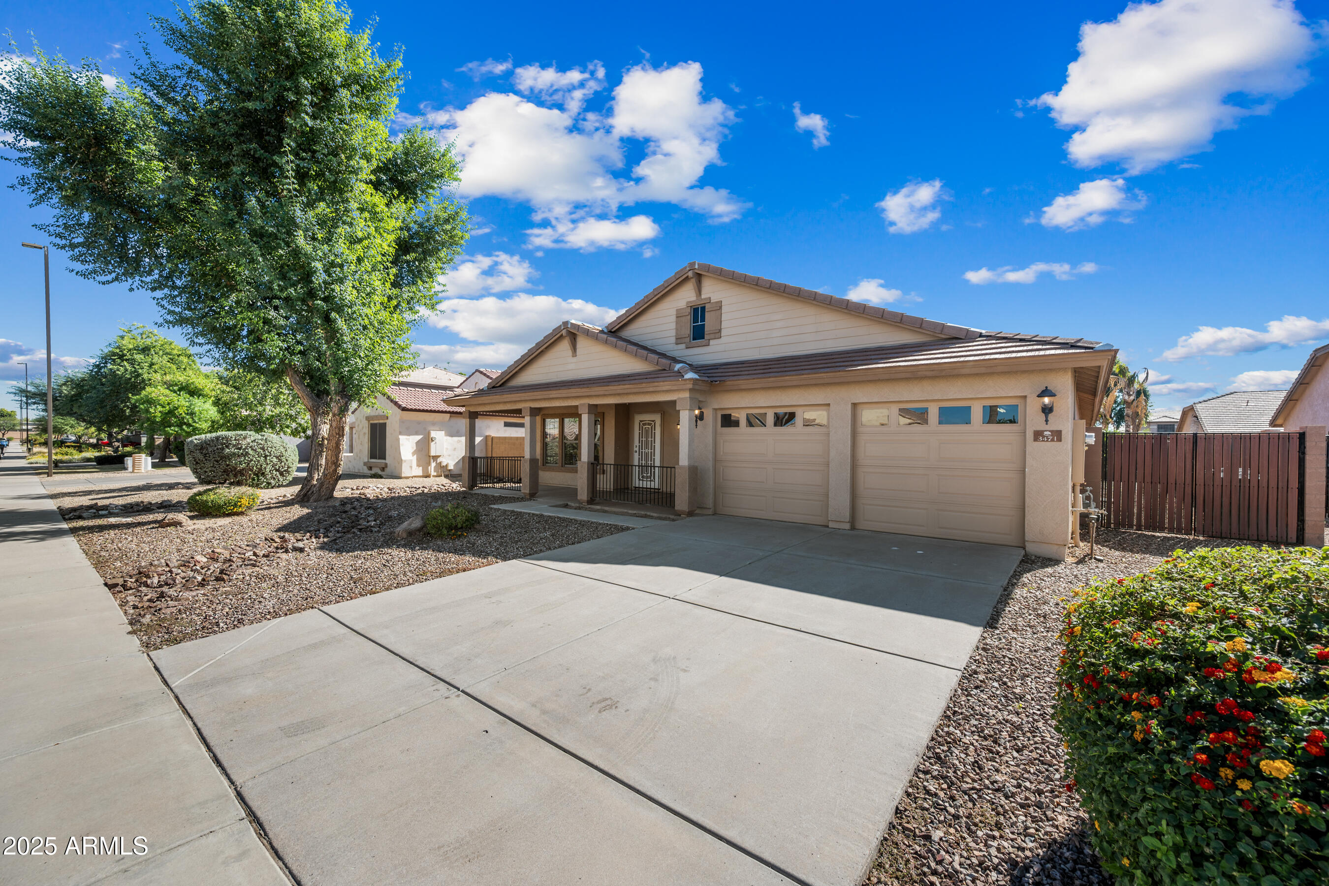 3471 East Fairview Street Gilbert, AZ 85295 - Photo 3 of 48 a front view of a house with a yard and garage