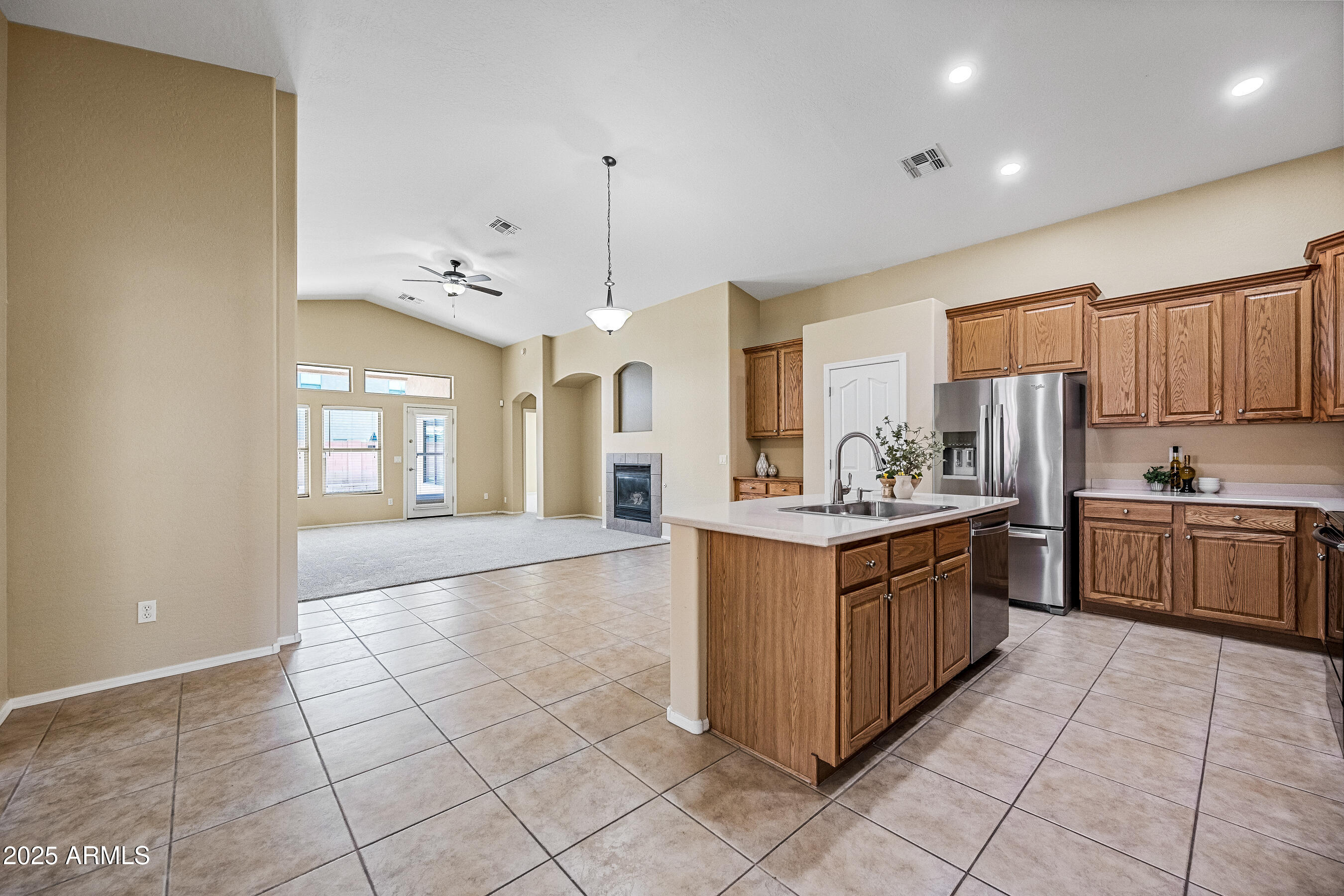 3471 East Fairview Street Gilbert, AZ 85295 - Photo 8 of 48 a large kitchen with stainless steel appliances granite countertop a stove refrigerator a sink and dishwasher