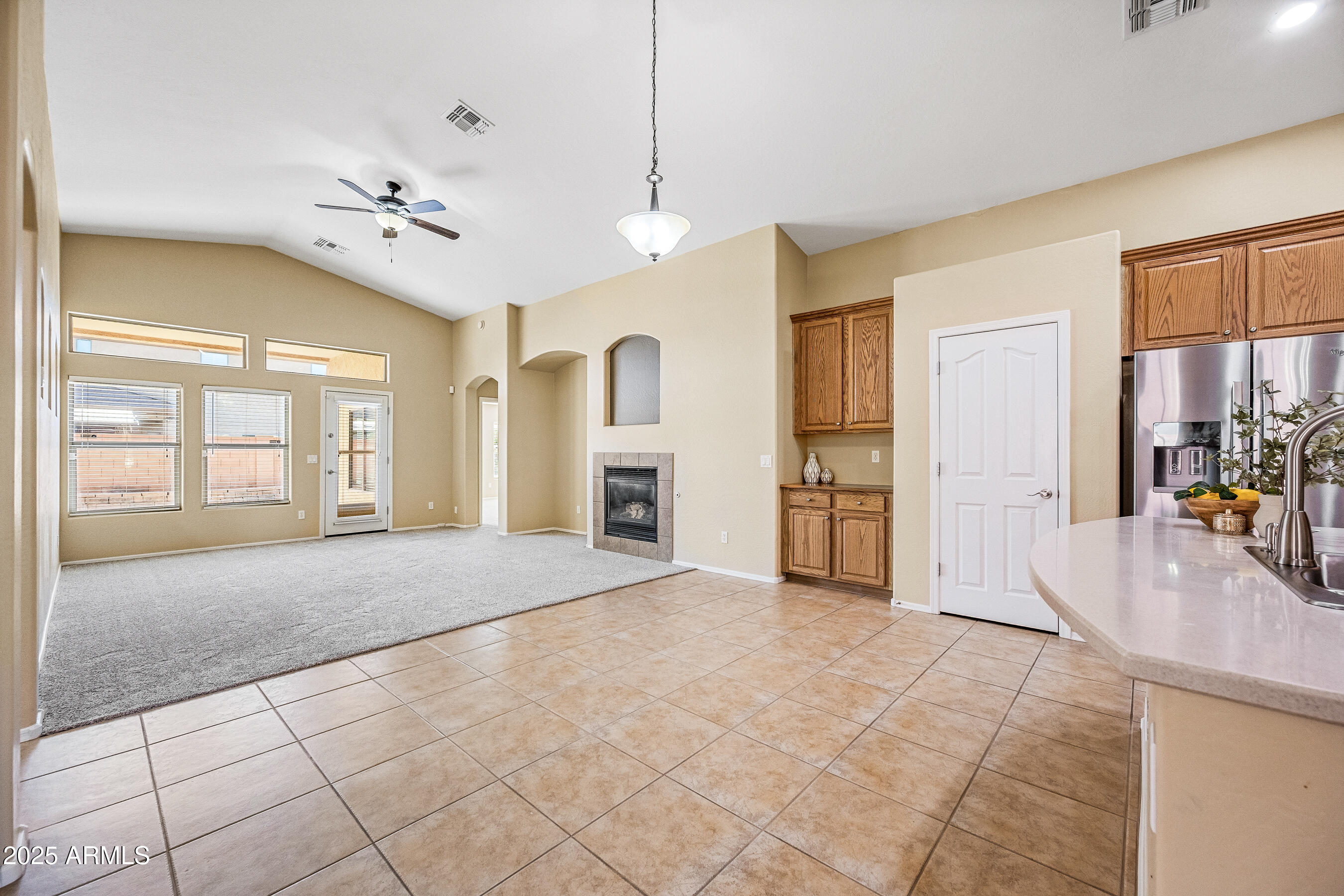3471 East Fairview Street Gilbert, AZ 85295 - Photo 9 of 48 a view of an empty room with a fireplace