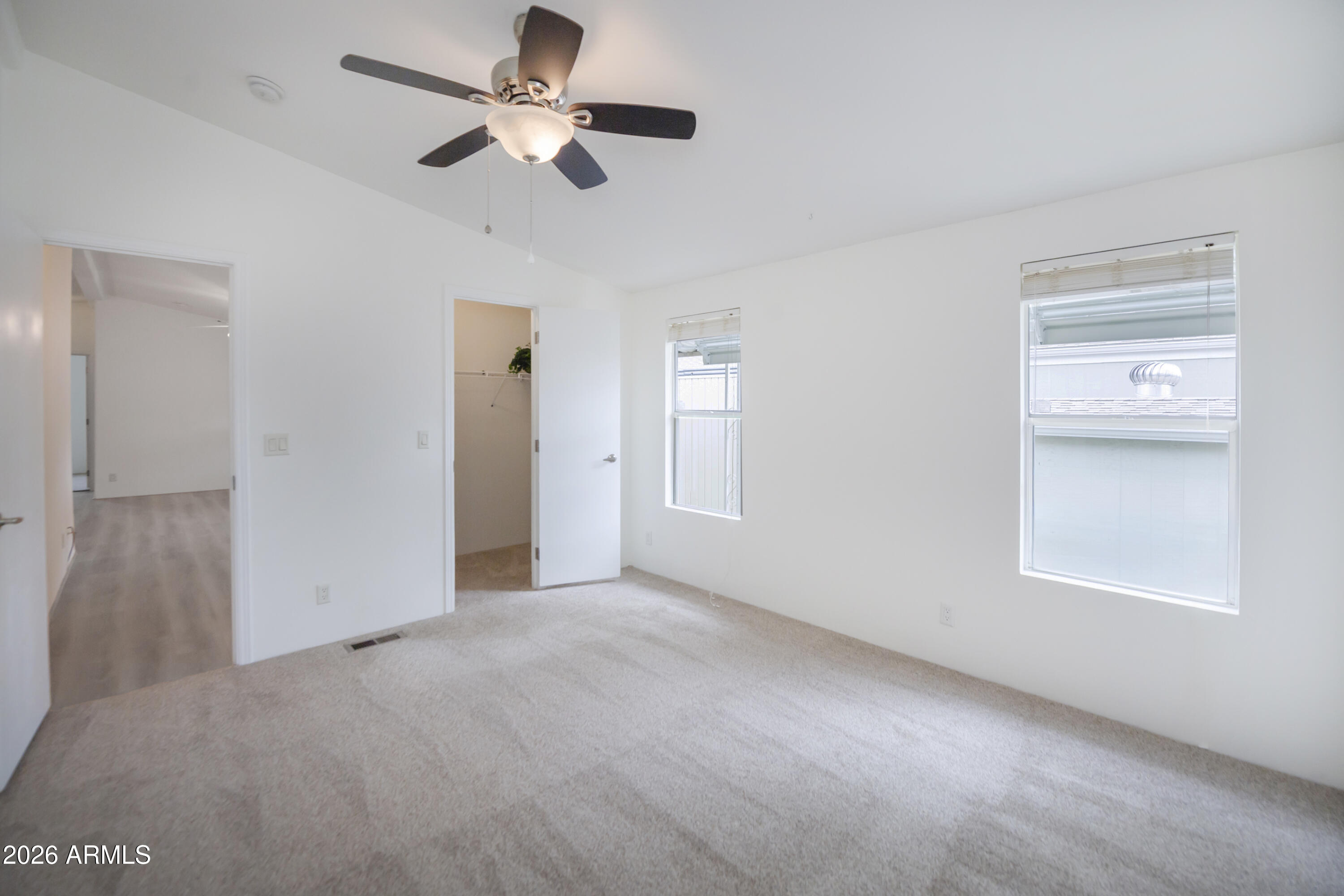 11250 East State Rte 69, Unit 1125 Dewey, AZ 86327 - Photo 19 of 45 a view of an empty room with a window