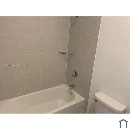 a back yard with a table and a fireplace