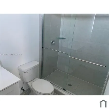 a room with a chair and a door