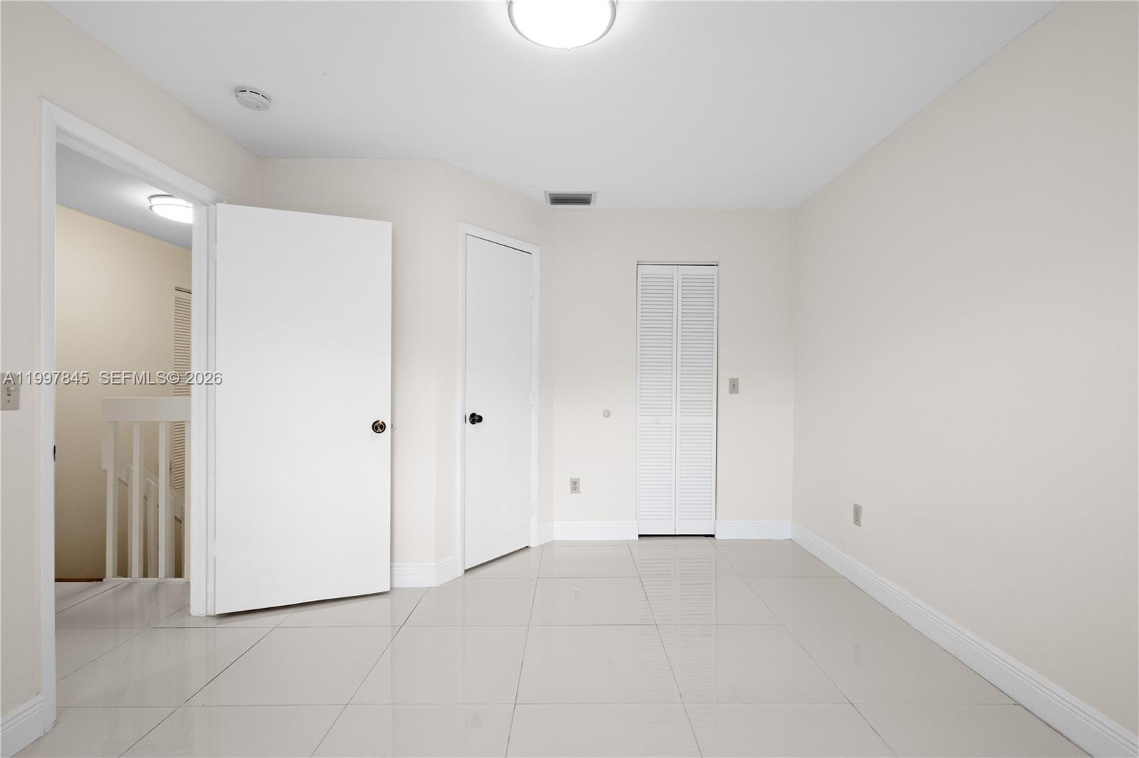 6211 Southwest 138th Court, Unit B Miami, FL 33183 - Photo 17 of 27 a view of an empty room
