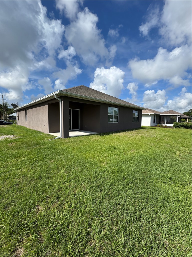1836 Barber Street Sebastian, FL 32958 - Photo 4 of 29 a view of a house with a yard