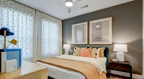 a bedroom with a bed and a window