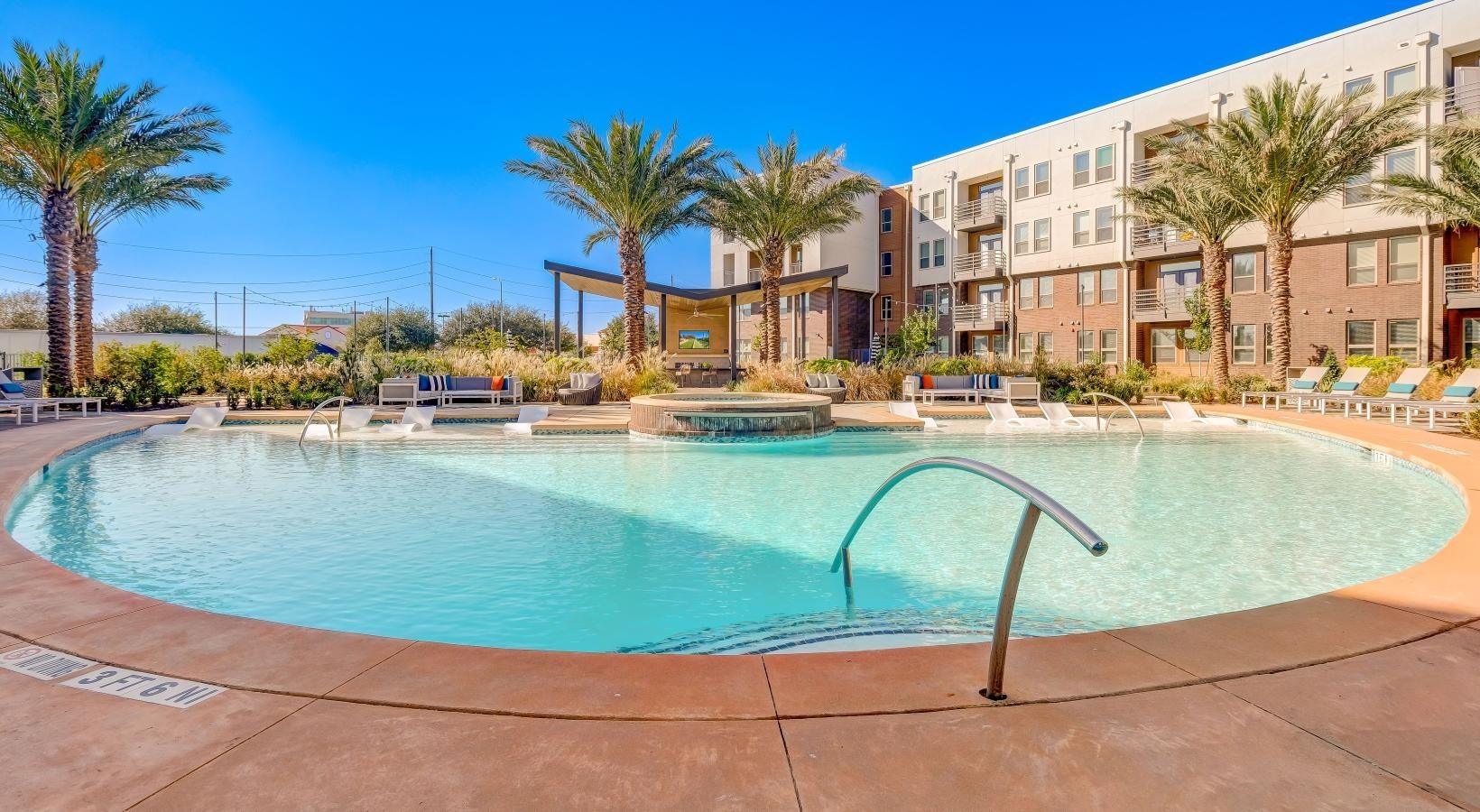 23233 Western Centre Drive, Unit A1 Katy, TX 77494 - Photo 6 of 14 a view of a swimming pool with a lounge chairs