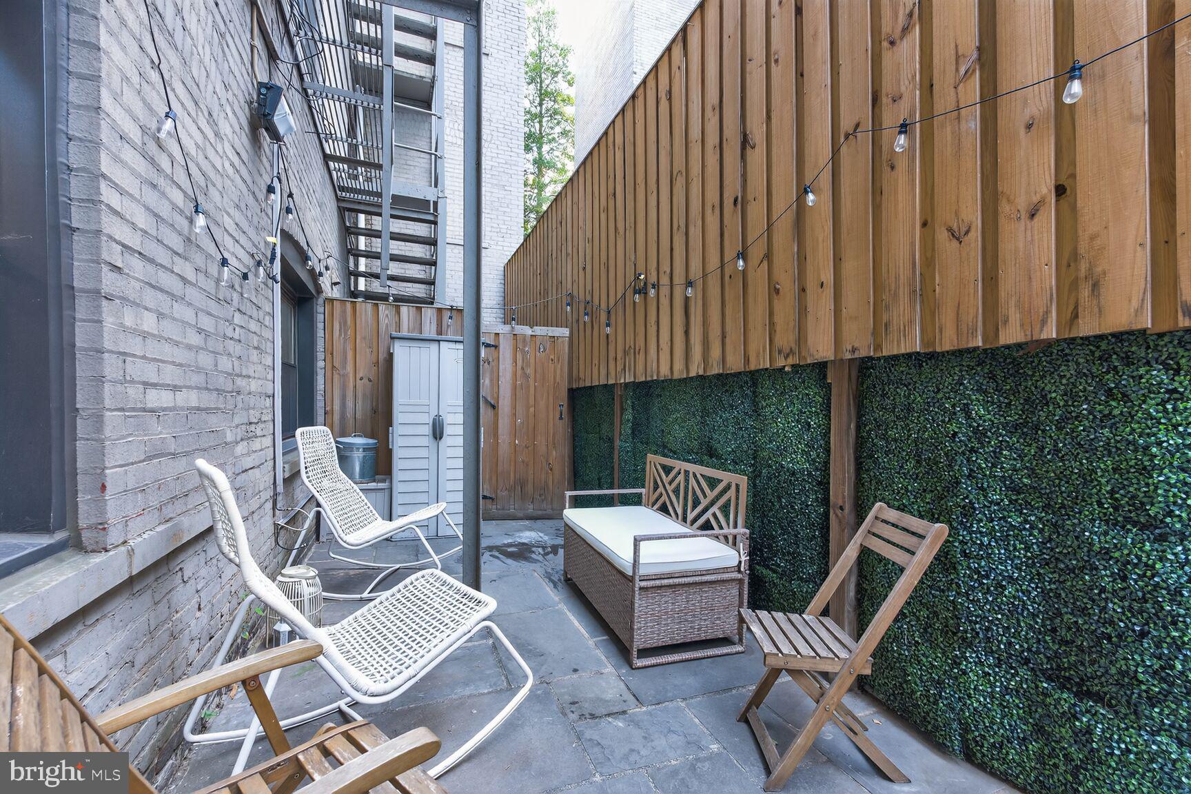 2012 O Street Northwest, Unit 12 Washington, DC 20036 - Photo 14 of 16 a view of backyard with outdoor seating and stairs