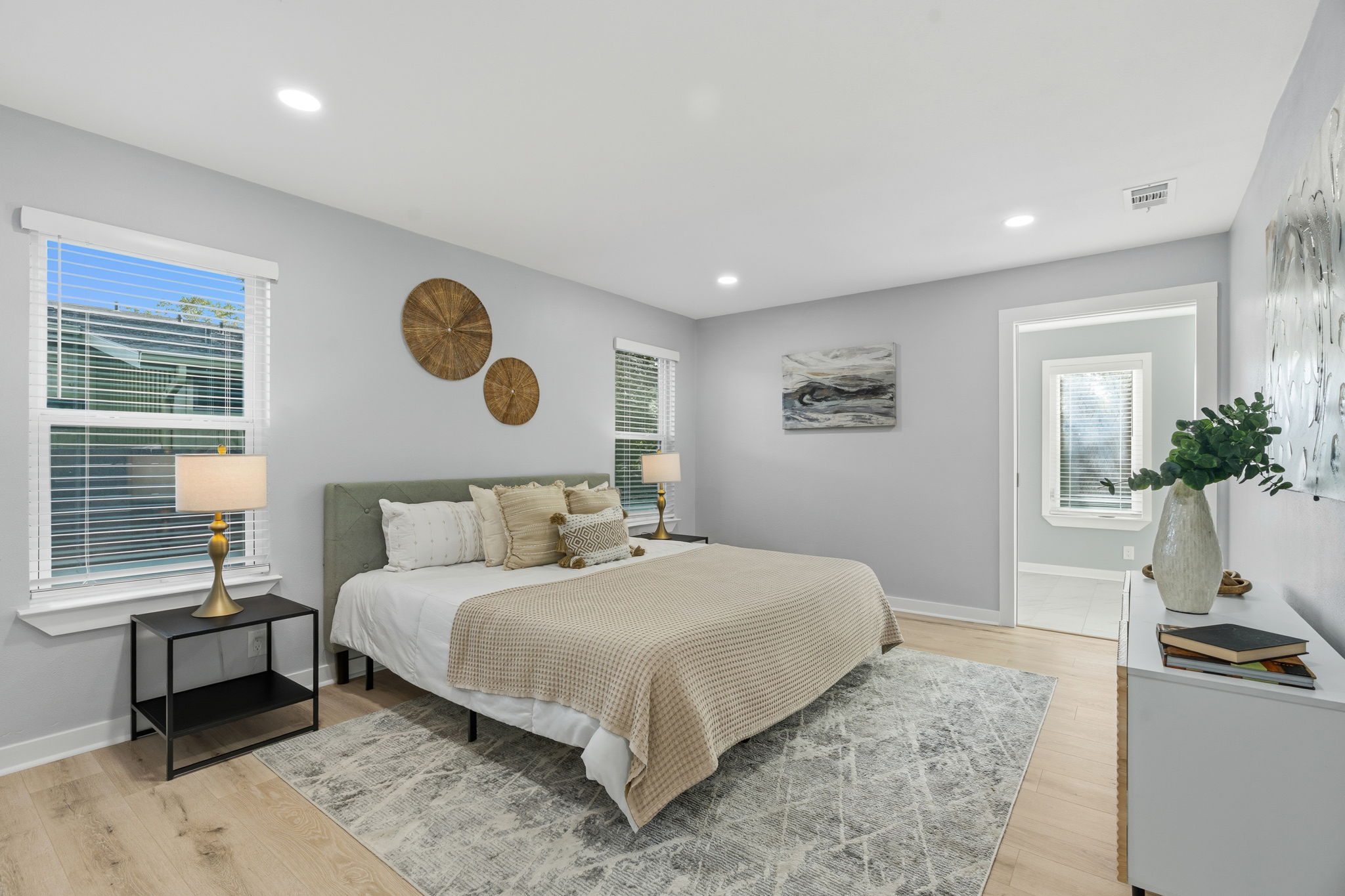 4802 Brighton Road Austin, TX 78745 - Photo 14 of 30 Spacious primary suite offers a peaceful retreat with generous proportions, abundant natural light, and direct access to the ensuite bath.