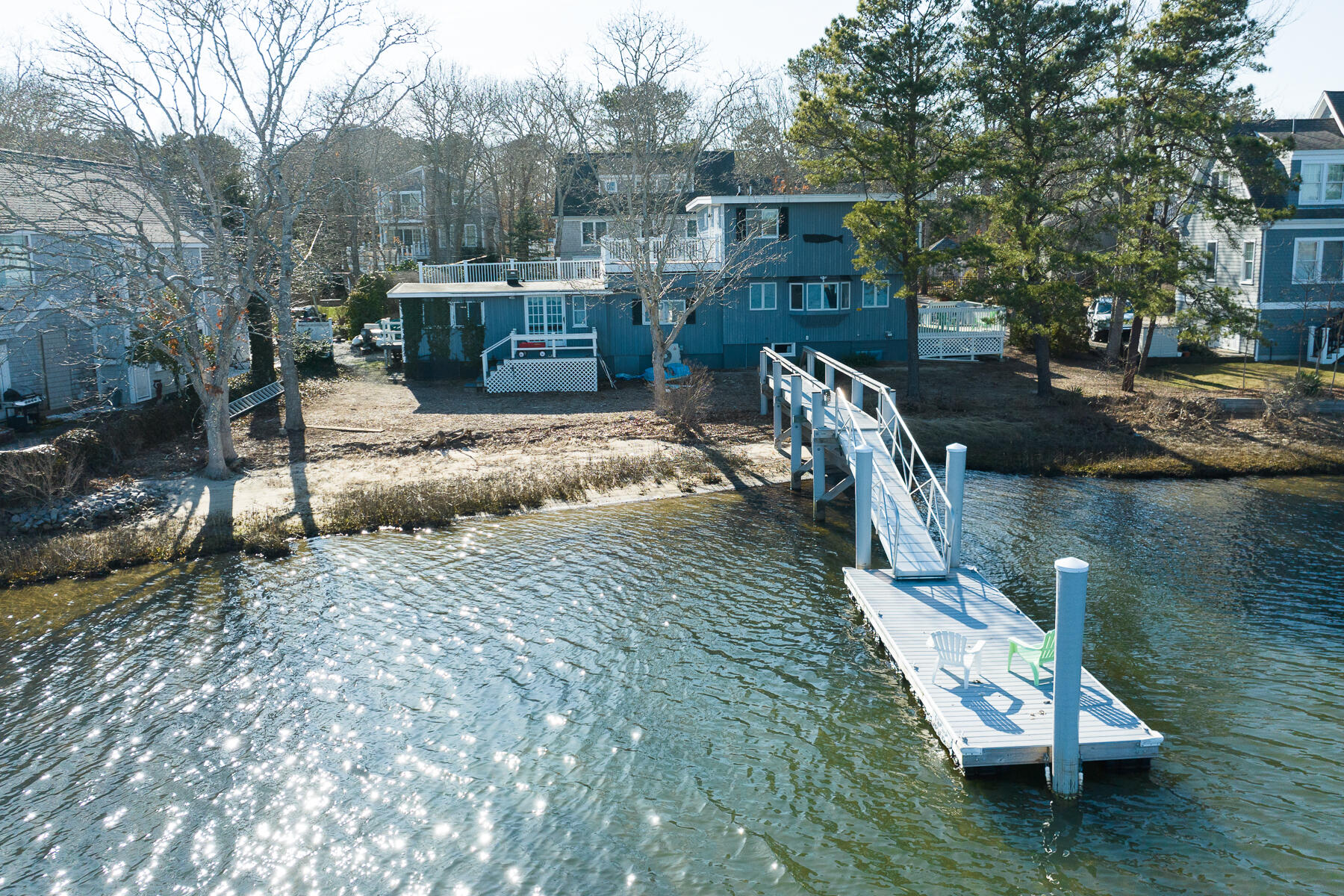 a view of a wooden deck and a backyard