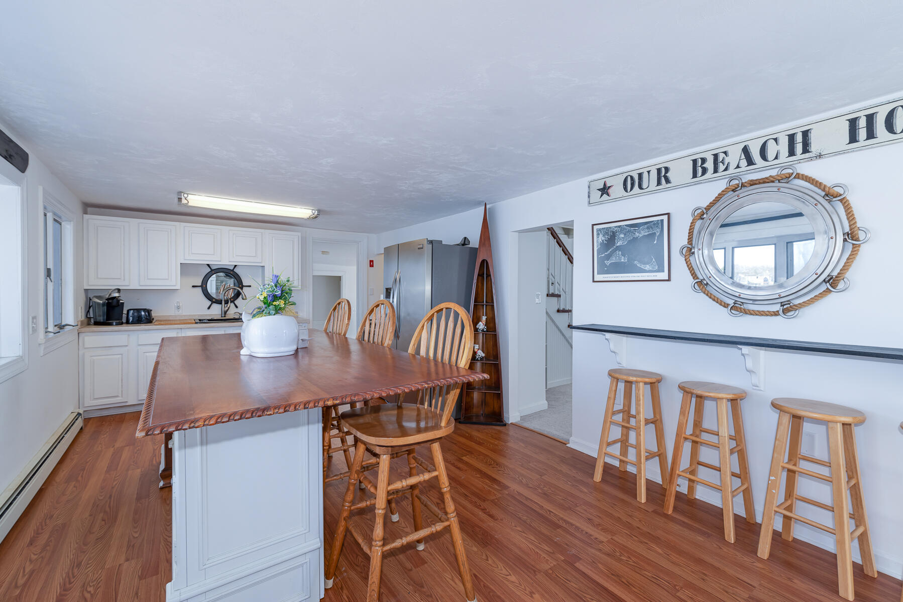 18 Great River Road Mashpee, MA 02649 - Photo 11 of 31 a kitchen with stainless steel appliances granite countertop a microwave a stove and white cabinets