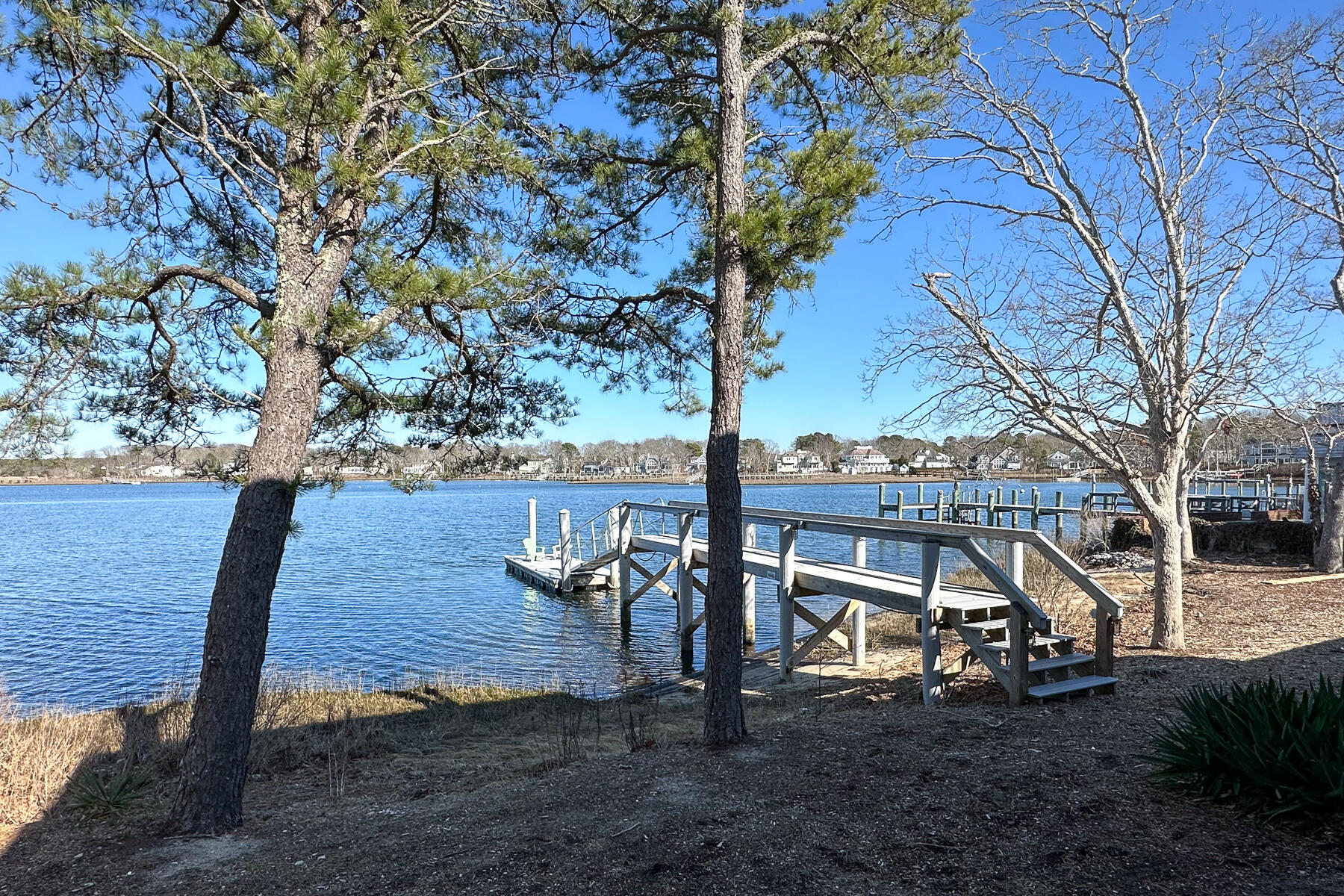 18 Great River Road Mashpee, MA 02649 - Photo 28 of 31 a view of a wooden bench next to a yard