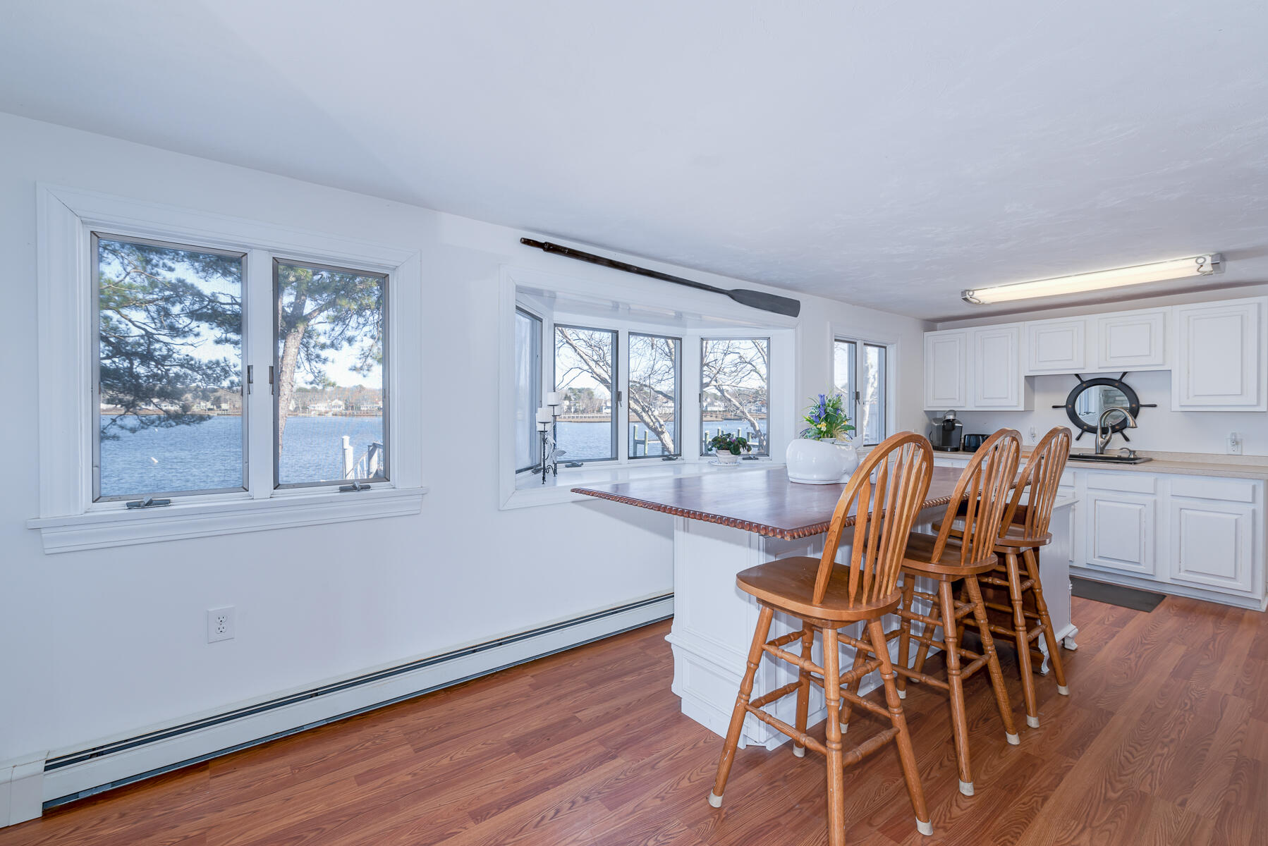 18 Great River Road Mashpee, MA 02649 - Photo 10 of 31 a view of a dining room with furniture window and wooden floor