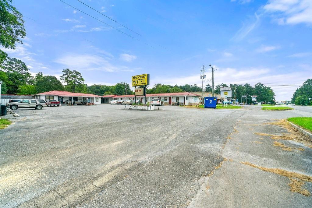 3158 Martha Berry Highway Rome, GA 30165 - Photo 5 of 10 a view of a city street with a building and cars park