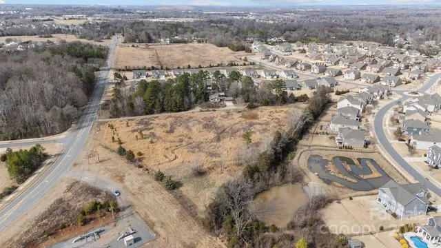 an aerial view of house with yard