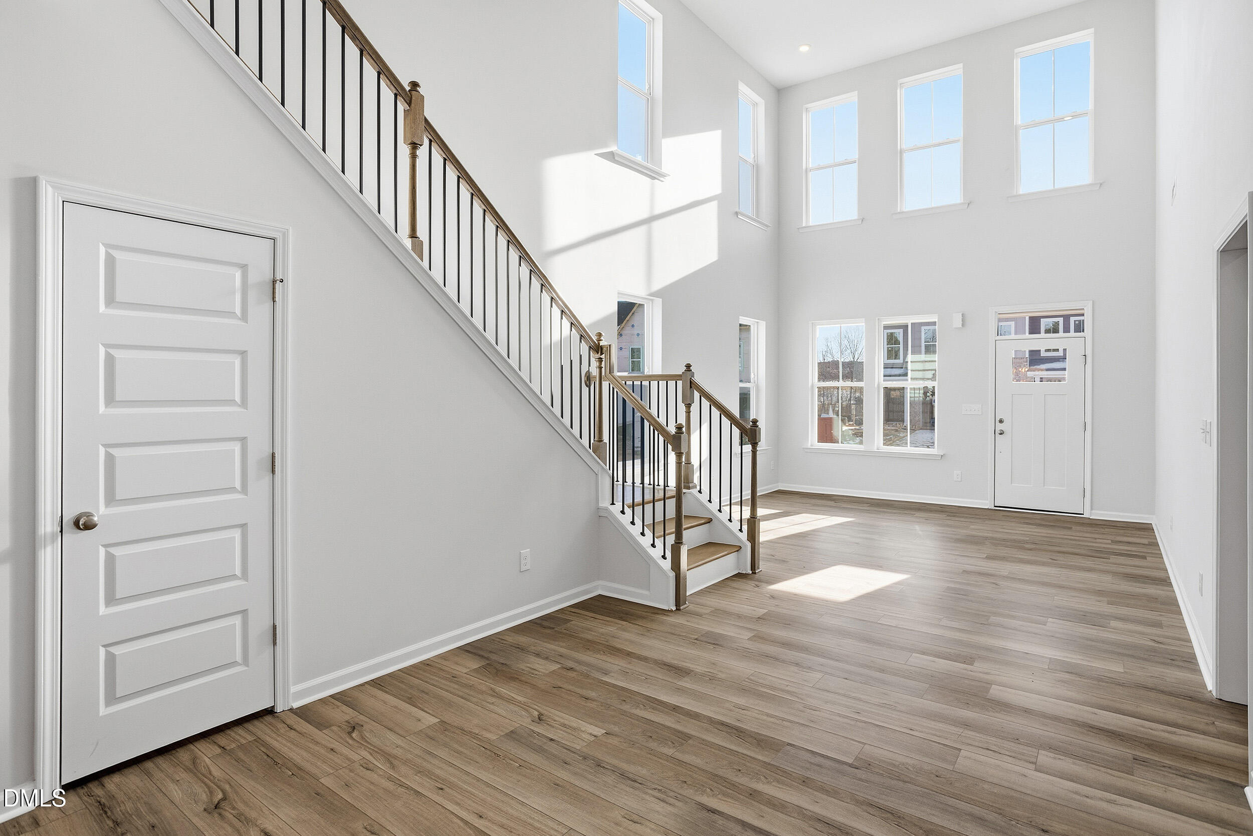 1209 Bell Heather Road, Unit 20 Durham, NC 27703 - Photo 11 of 23 a view of entryway with wooden floor and stairs