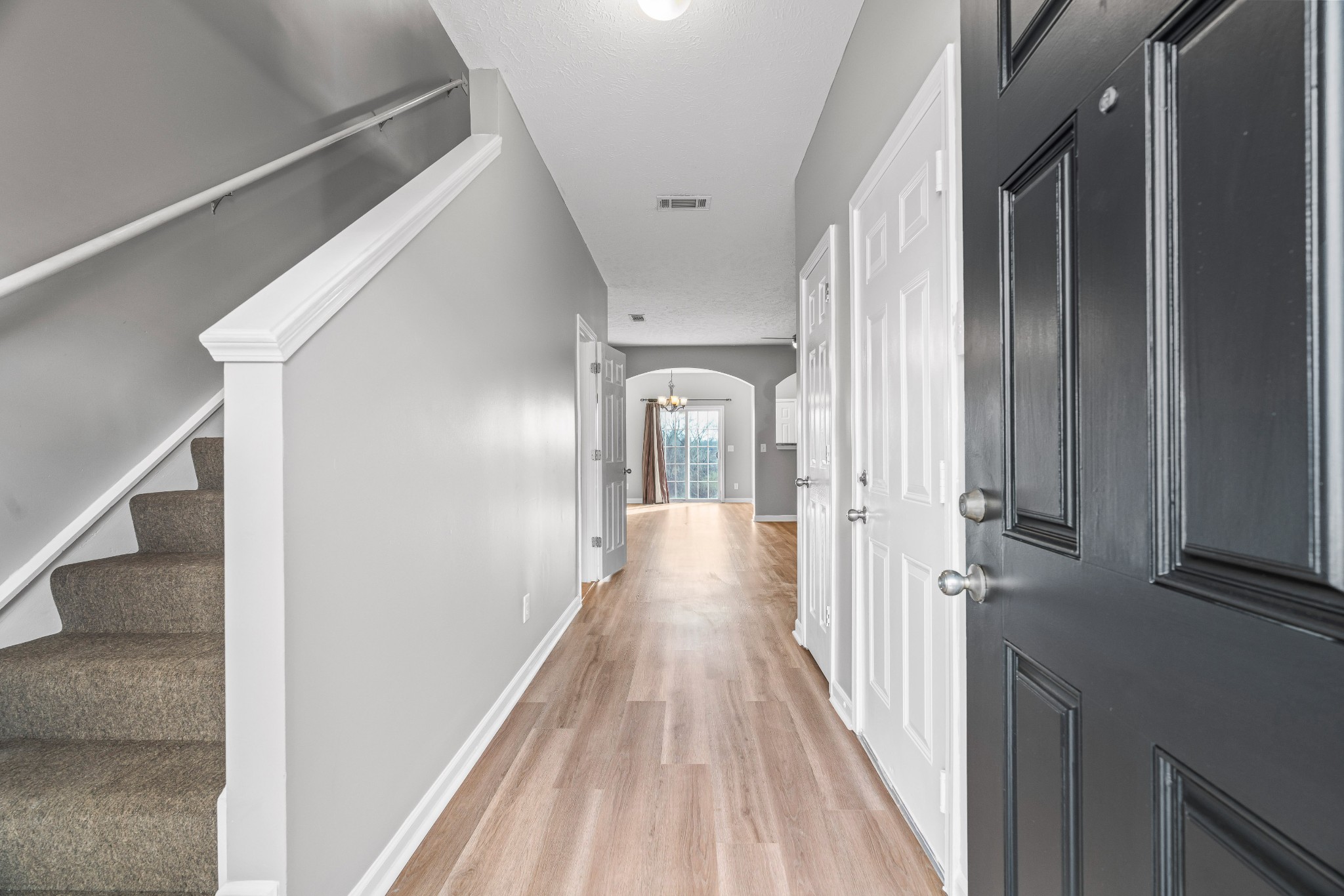 8324 Rossi Road, Unit 8324 Brentwood, TN 37027 - Photo 13 of 41 a view of a hallway with wooden floor and staircase