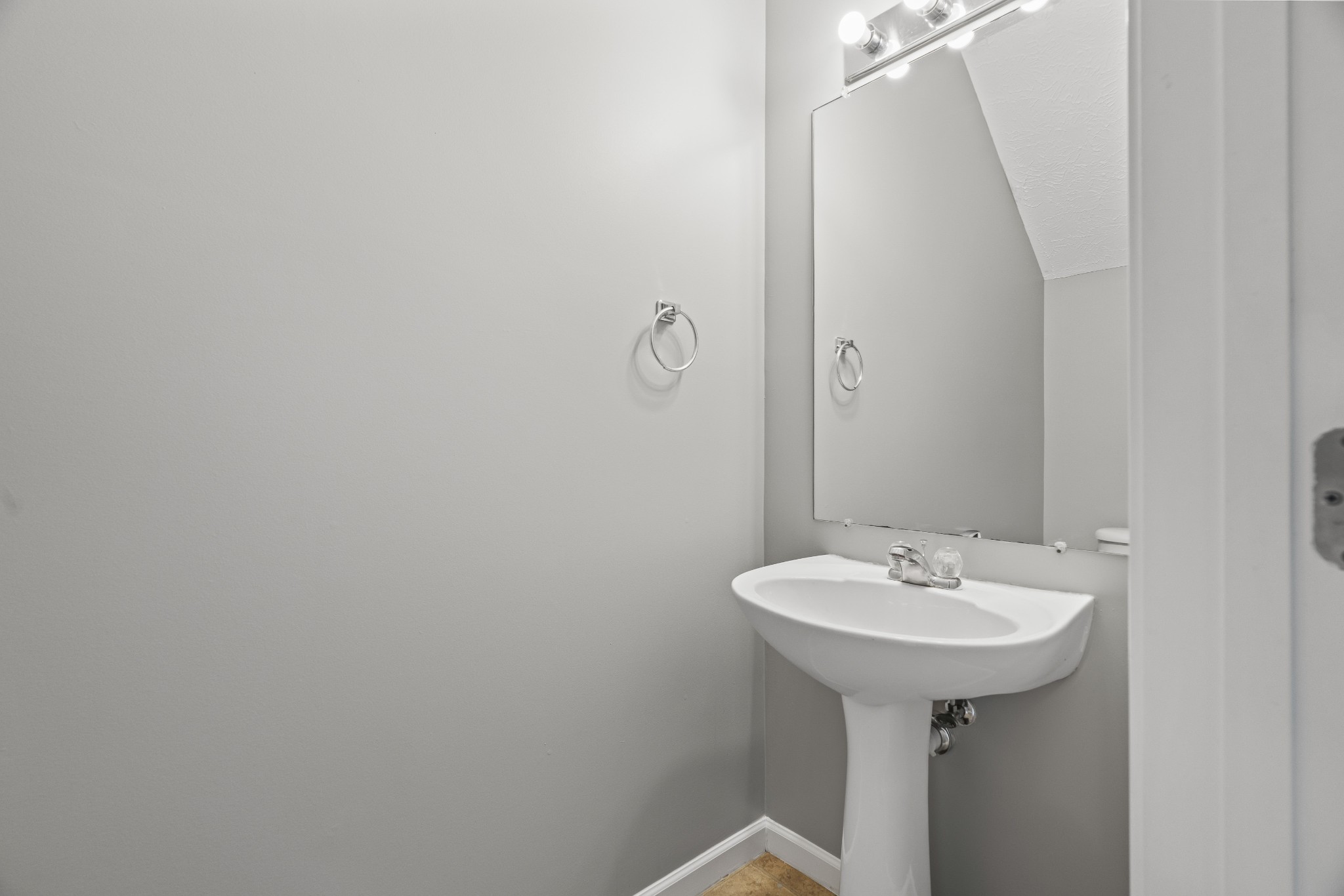 8324 Rossi Road, Unit 8324 Brentwood, TN 37027 - Photo 17 of 41 a bathroom with a sink and a mirror