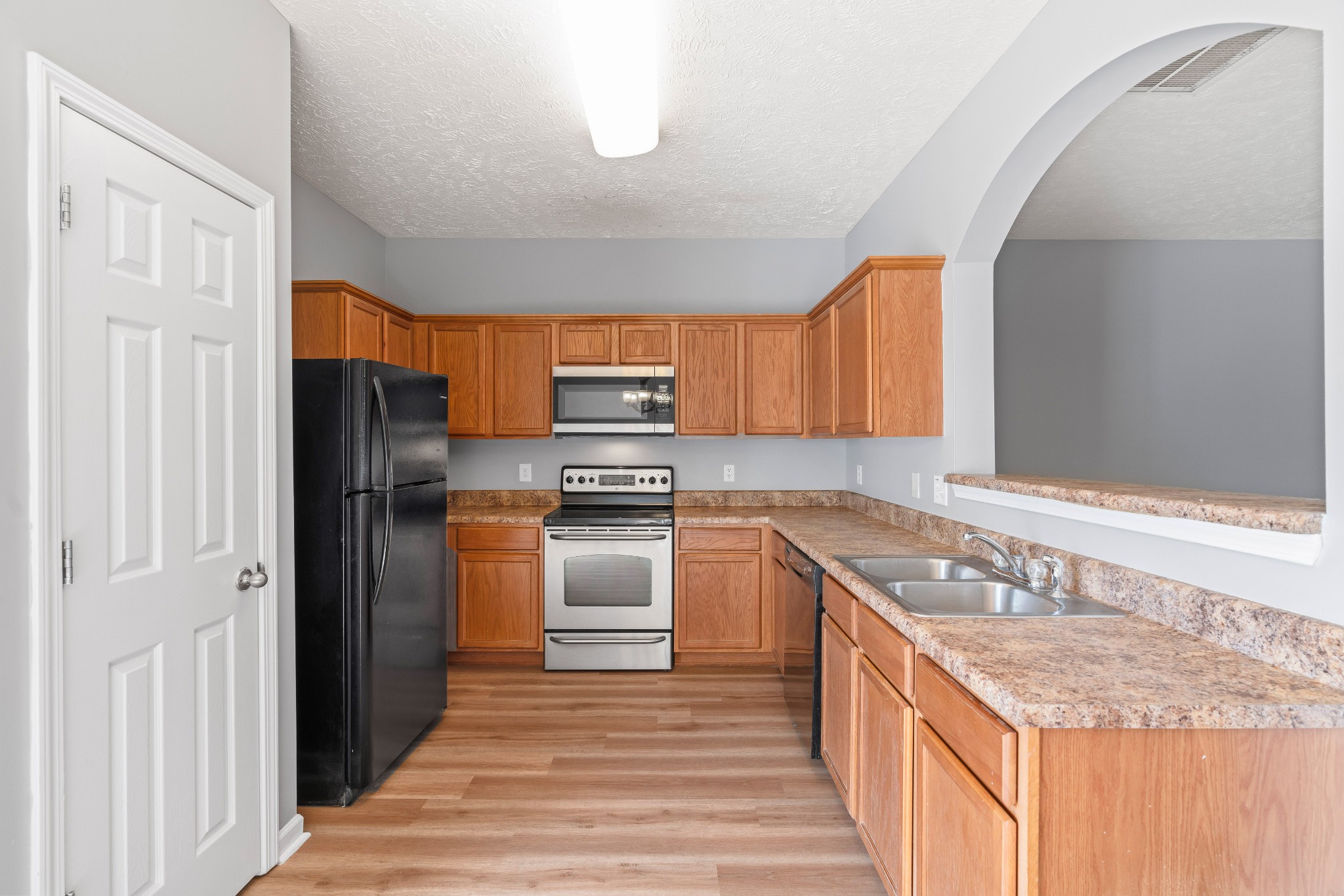 8324 Rossi Road, Unit 8324 Brentwood, TN 37027 - Photo 24 of 41 a kitchen with stainless steel appliances granite countertop a refrigerator and a sink