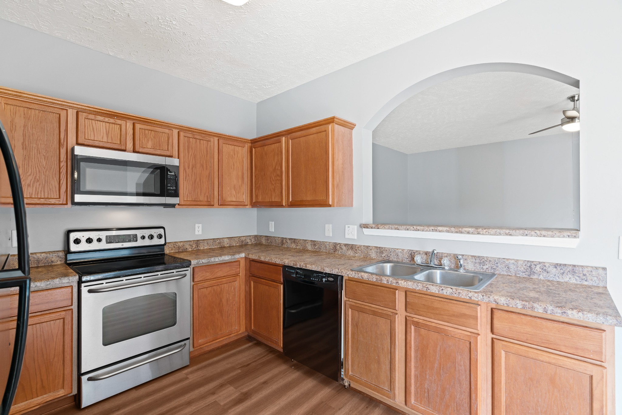 8324 Rossi Road, Unit 8324 Brentwood, TN 37027 - Photo 25 of 41 a kitchen with granite countertop a sink stainless steel appliances and cabinets