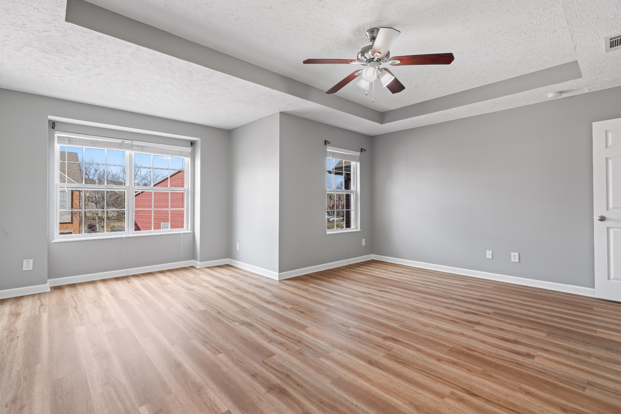 8324 Rossi Road, Unit 8324 Brentwood, TN 37027 - Photo 6 of 41 a view of an empty room with a window and wooden floor