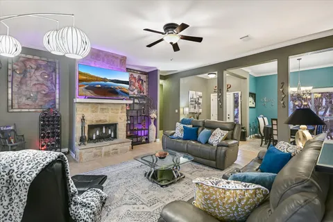 a living room with furniture and a fireplace