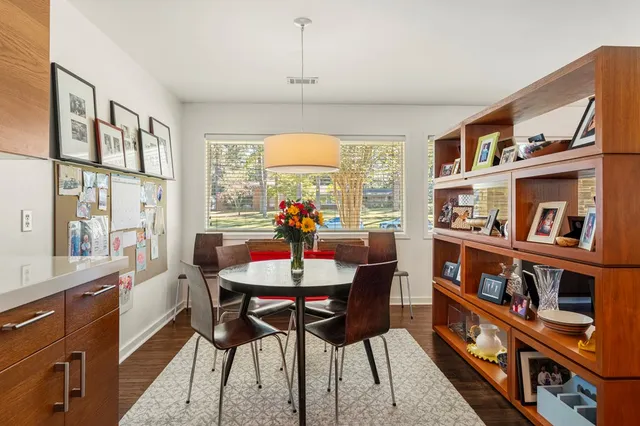a view of a livingroom with furniture window and wooden floor