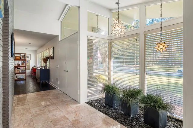 a view of a porch with a potted plant