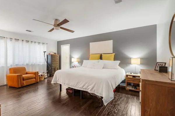 a bedroom with a bed and a couch
