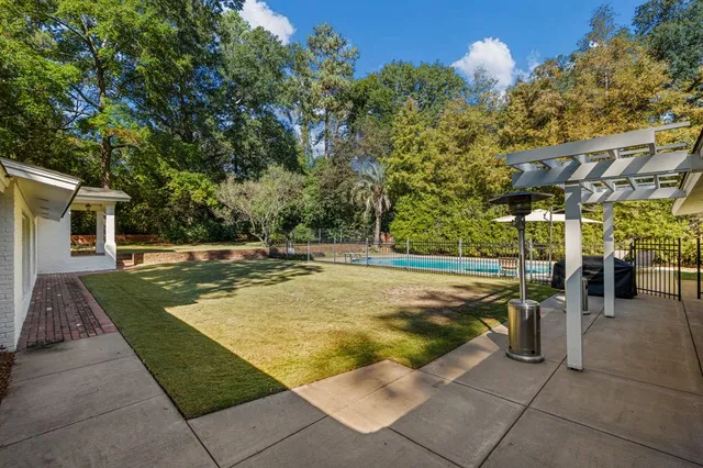 a view of a swimming pool with a patio