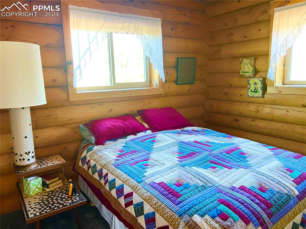 280 Kerrs Hill Road Westcliffe, CO 81252 - Photo 12 of 35 a bedroom with a bed and a window