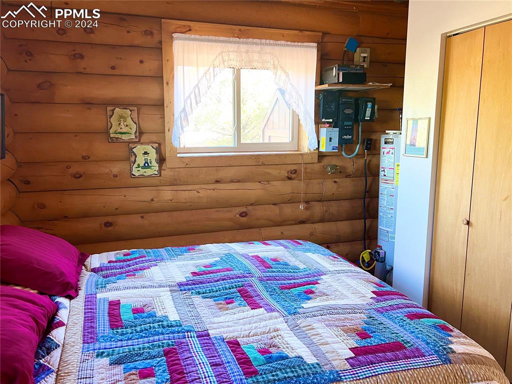 280 Kerrs Hill Road Westcliffe, CO 81252 - Photo 13 of 35 a bedroom with a bed and a window