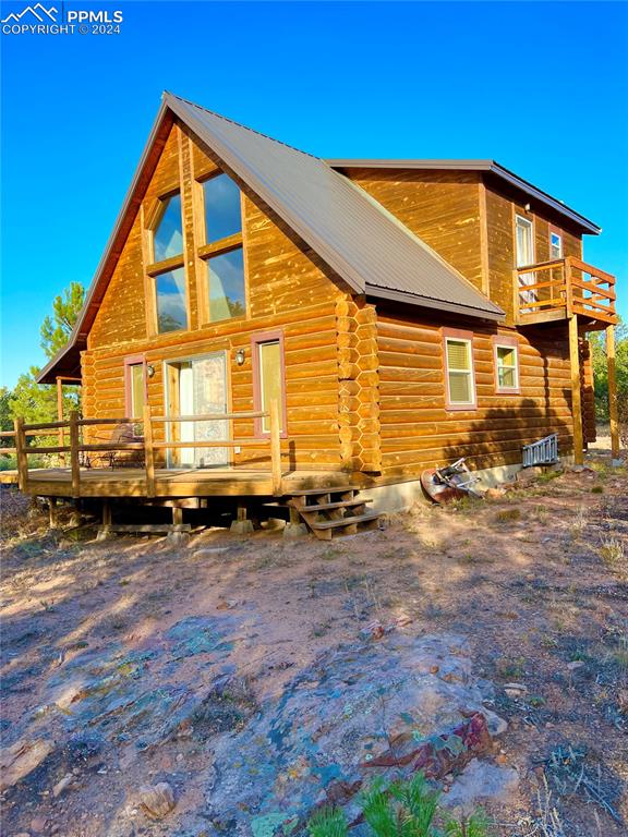 280 Kerrs Hill Road Westcliffe, CO 81252 - Photo 3 of 35 a front view of a house with a yard