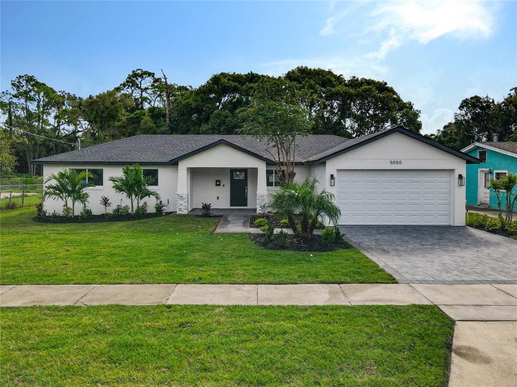 5050 Lake Howell Road Winter Park, FL 32792 - Photo 1 of 1 a front view of a house with a garden