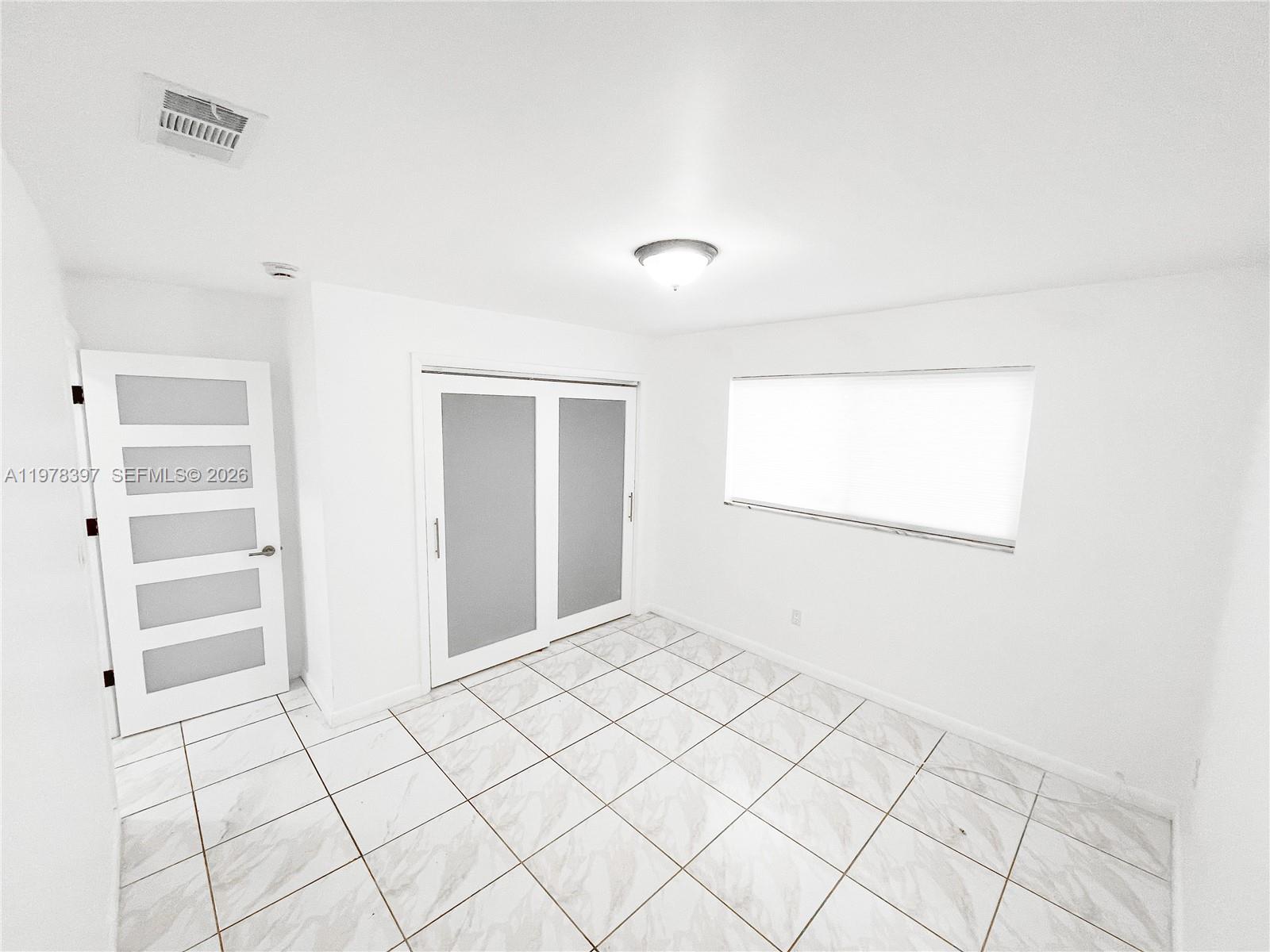 3423 Southwest 3rd Street, Unit 1 Miami, FL 33135 - Photo 14 of 18 a view of an empty room