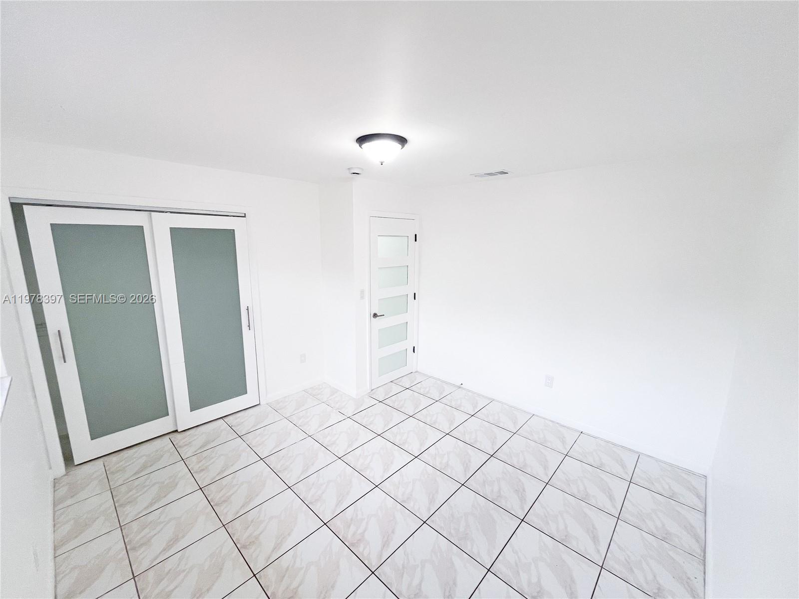 3423 Southwest 3rd Street, Unit 1 Miami, FL 33135 - Photo 16 of 18 a view of an empty room